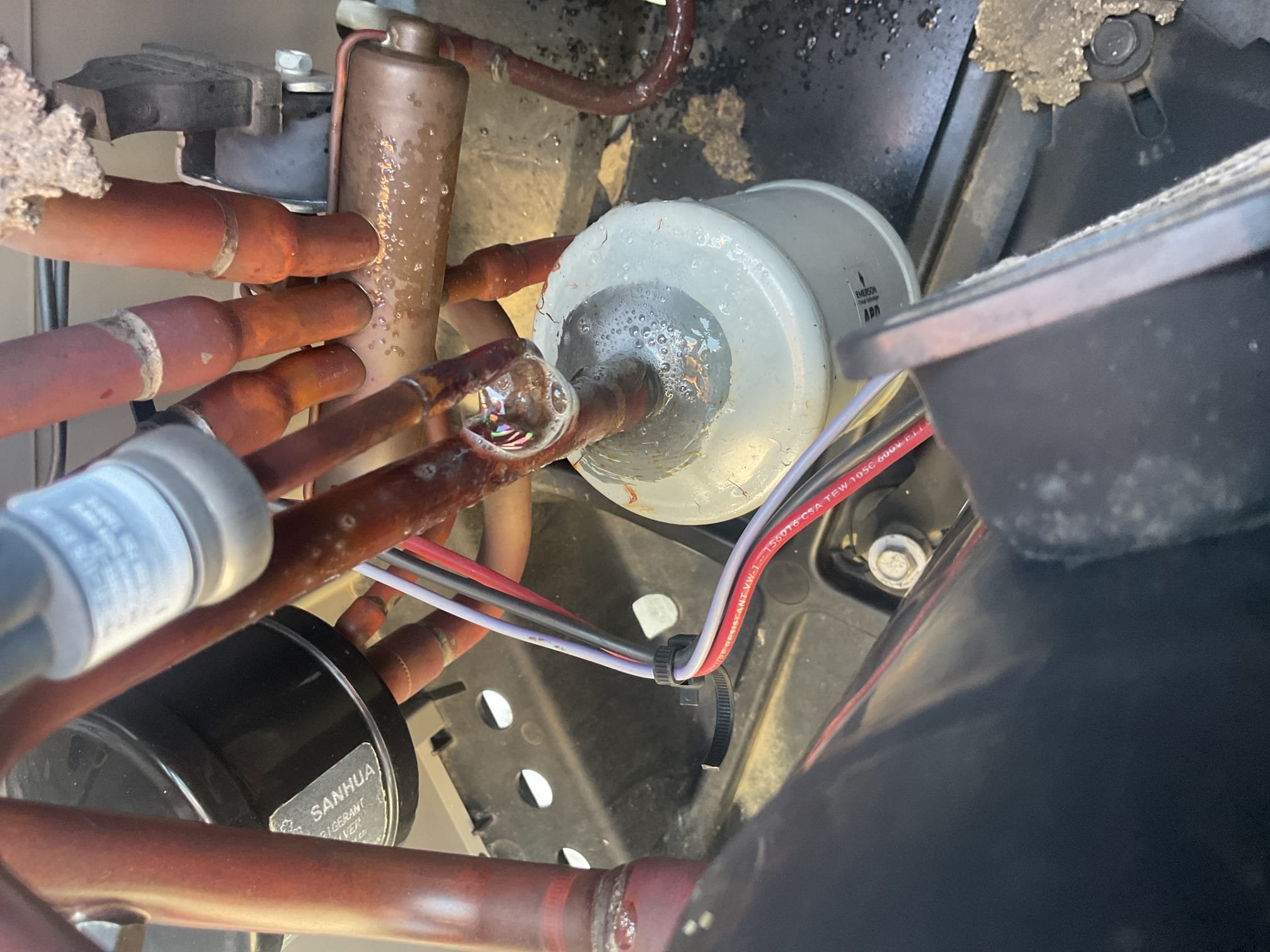 8/19/26. Fully assessed no cooling situation on 2016 Rudd heat pump system. Gave system a call for cooling and went up on roof. Found 410a heat pump system running at 132/14 pretty much flat. Found bad leak at high pressure switch provided option to repair. Also would consider replacement. Added back in factory 410a refrigerant charge for now. 410 a refrigerant pressures are 335/134 with 11 subcooling, temperature split is 18 degrees. A/c is working at this time but do not know how long charge will last. 
