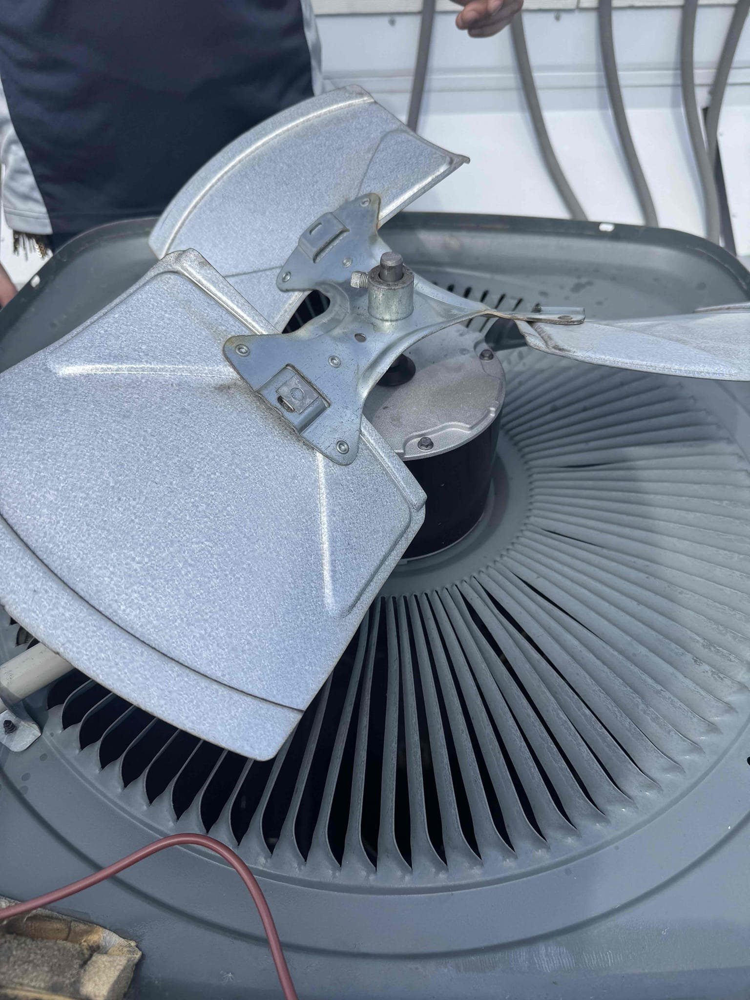 8/21/26 Kurt and Conner: replaced failed condenser fan motor on Goodman heat pump system. Disconnected wiring, removed fan blade, and extracted motor with fan puller. Installed new motor and tested operation. 
System is operating normally at this time 