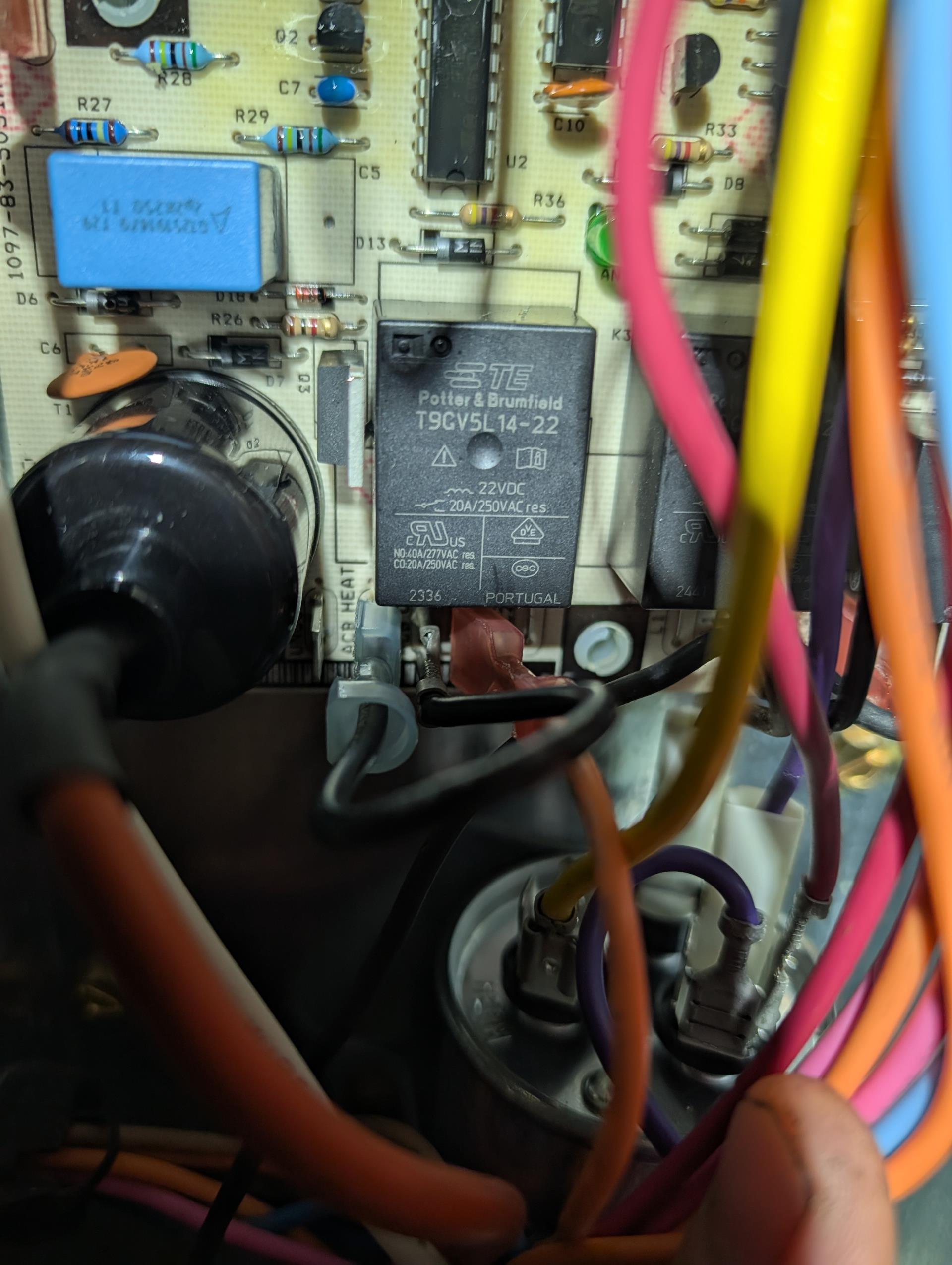 Issue was with indoor fan not energizing as designed.
Employees at Riverworks have replaced failed transformer. They also replaced contactor, thermostat, dual capacitor, and control board. 
Voltage to this building is 208 so I moved the hot lead on primary side of transformer to the appropriate tap (208V). 

(2) issues were preventing indoor blower from working as designed.
 1. the internal thermostat jumper was set for a 2wire (2-transformer system) I put back to a 1 wire and
2. The high voltage orange wire was landed on the “unused” terminal on control as opposed to the HEAT or COOL terminal (which in this case is jumpered. 

Wired everything correctly and tested system.

Operating well at this time. 