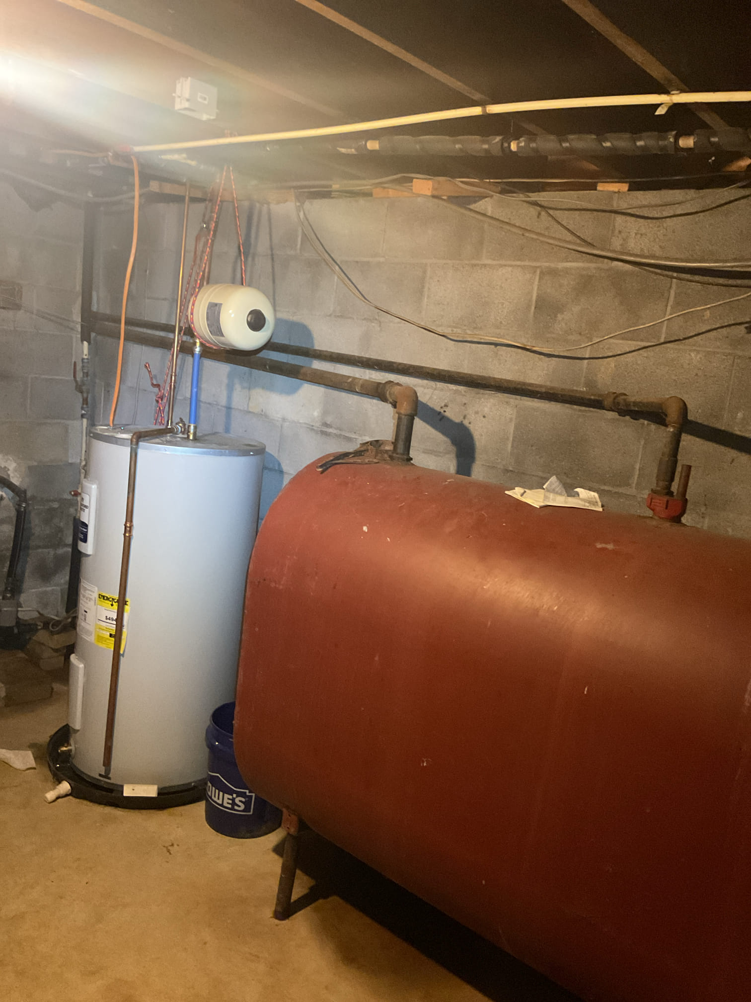 Luis 9-17-26 
Performed oil boiler tune up on Weil McLain boiler from 2014
Component Replacements: Swap out the oil burner nozzle, oil filter cartridge (canister rf1) and the pump strainer screen.
Cleaning & Inspection: Brush and vacuum soot build-up from the heat exchanger sections, flue pipe, and chimney base; clean the CAD cell eye and burner blower wheel.
Ignition & Assembly Setup: Set electrode gap, spacing, and height to manufacturer specifications; check porcelain insulators for cracks.

Combustion Analysis: Test draft over-fire and at the stack, check pump pressure (PSI) and cut-off, test for smoke spot number (#0 ideal), and measure CO_/ 02 and stack temperature to calculate thermal efficiency.
System & Safety Controls: Verify high-limit aquastat shut-off, check system water pressure/temperature, inspect expansion tank air charge, check for fuel leaks, and verify circulator pump operation.

Oil tank is very old, customer is aware. Provided estimate to replace tank 

Some of th