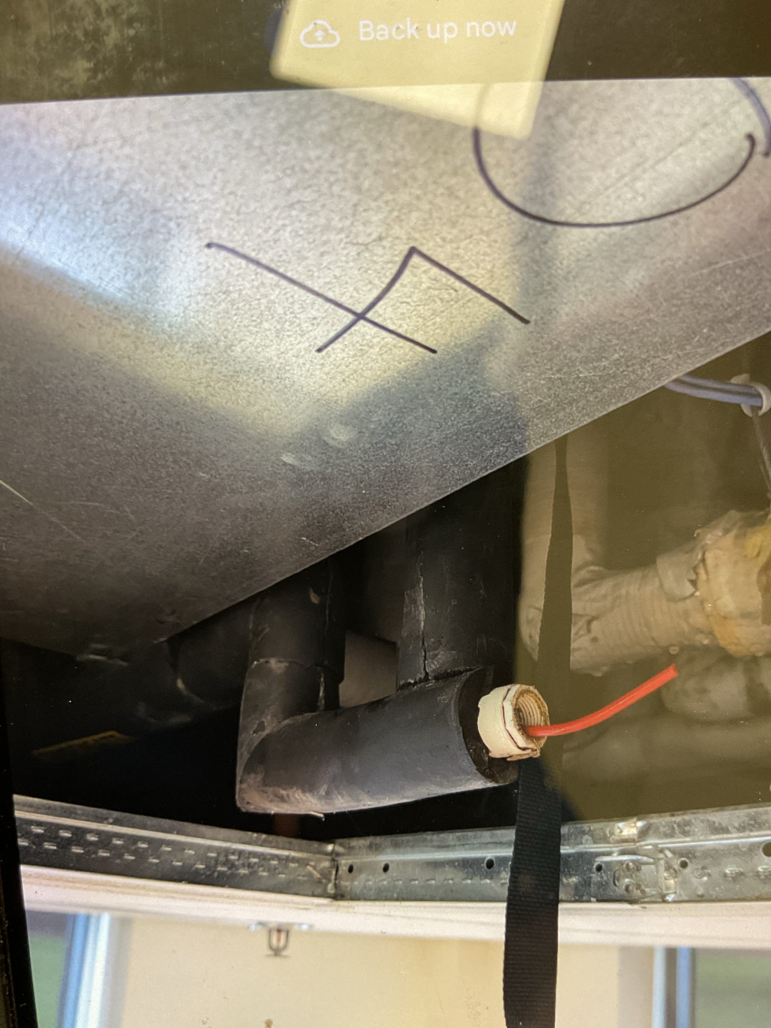 There are (3) classrooms that have been struggling to cool according to one person on site Rooms 119, 117, 116

Equipment is chiller air handler. 
16x25x1 filter ok
Found the air handler in 117 above drop ceiling.
Auxiliary pan was full of water,
Blower motor is running. 
Siphoned and used wet vac to remove water from auxiliary pan. 
There is a float style pan switch but it is unclear how it interacts with BAS system. 
Brushed out top at available clean out. 

Temperature split is 12° 74-62. 
Room temperature dropped 2° after I cleared pan and float switch reset. 

I told Steve to monitor the BAS and room temperatures. If cooling performance issues persist, it is likely that the chiller itself is the culprit. 