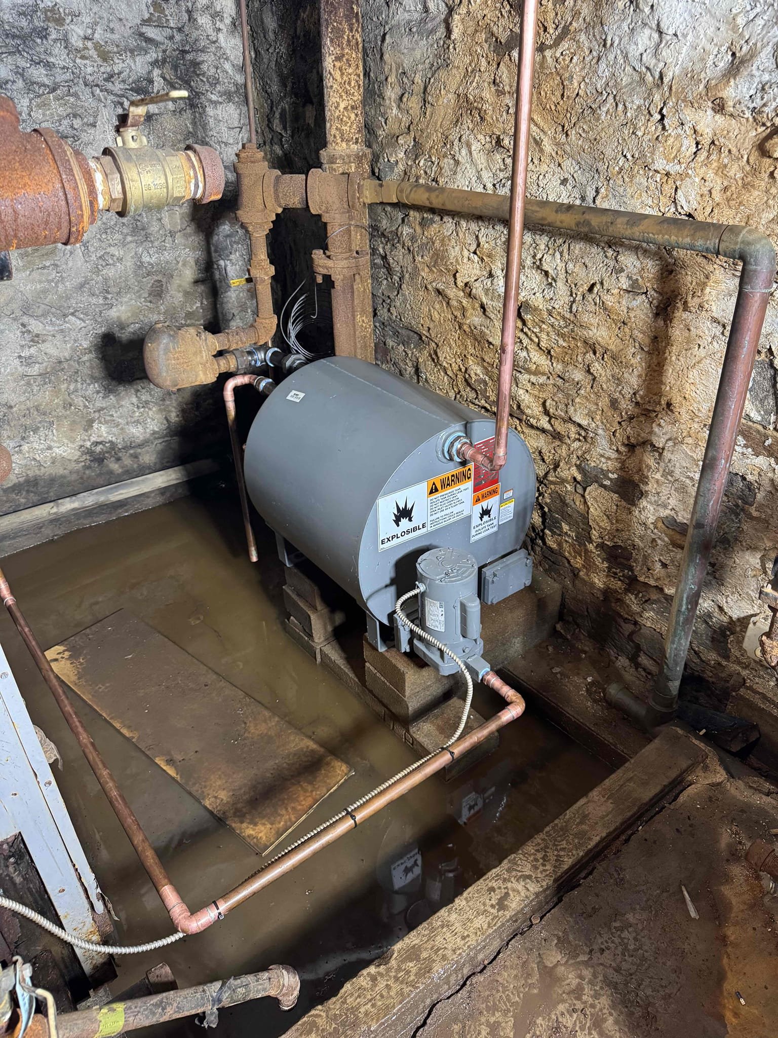 Upon arrival, the system was already drained. I replaced the condensate return tank for the steam boiler. After filling the system, I discovered a cracked boiler block causing water to dump onto the burners. Additionally, there was a significant leak on the wet return behind the boiler. To prevent further damage, I turned off the power to all components and shut off the water feed to the tank. I promptly contacted management and documented the issues with photos and videos. Unfortunately, no payment was collected as no one was present.