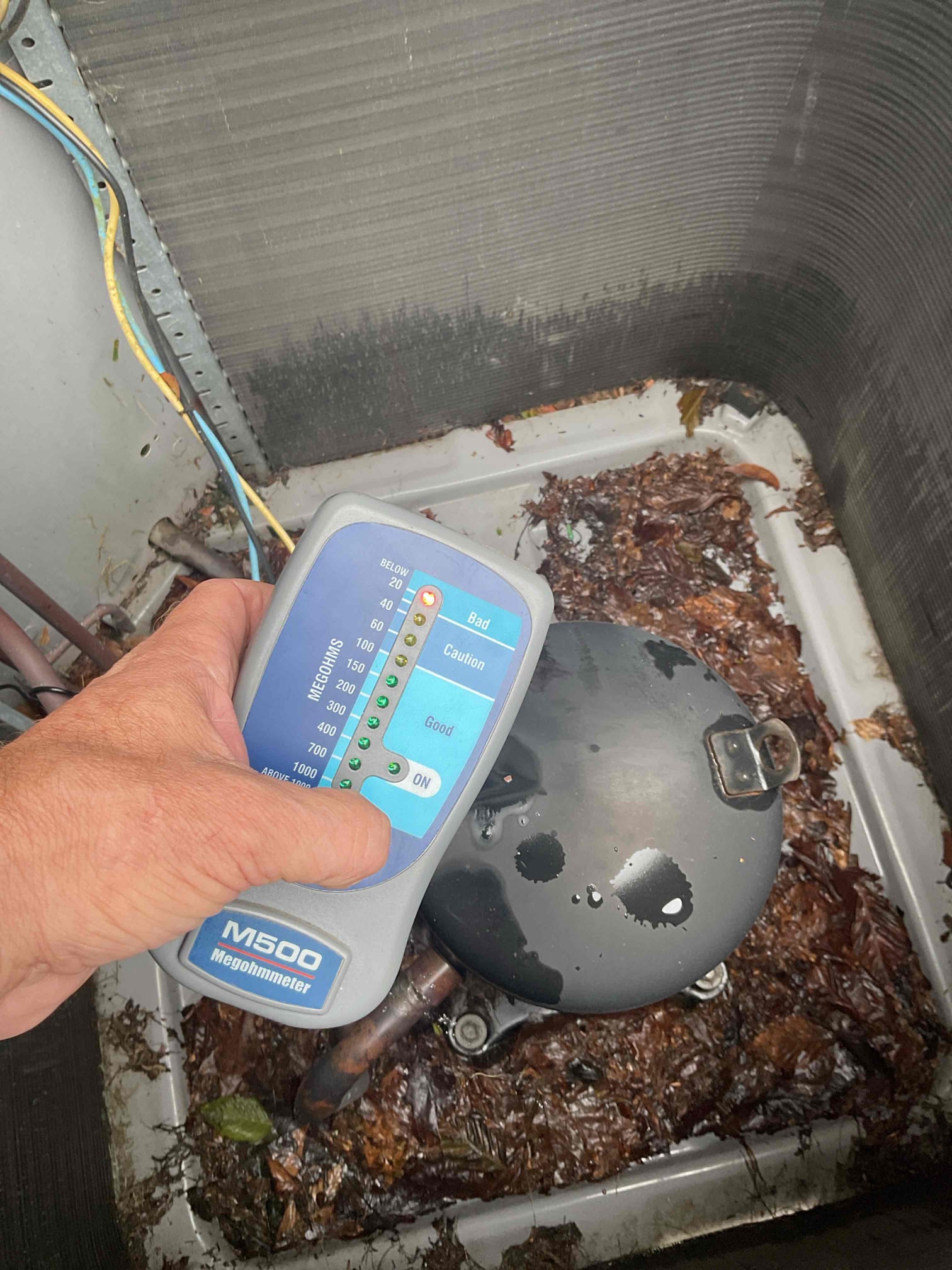 On 9/28, I inspected an outdoor AC unit that was tripping the indoor breaker. The unit, over 15 years old and using R-22 refrigerant, required a thorough examination. After removing the top, I inspected the compressor and found the terminals' pins to be severely degraded. This failure was confirmed by a mega ohm test. I collected my $99 fee via credit card. Bob will present replacement options later.