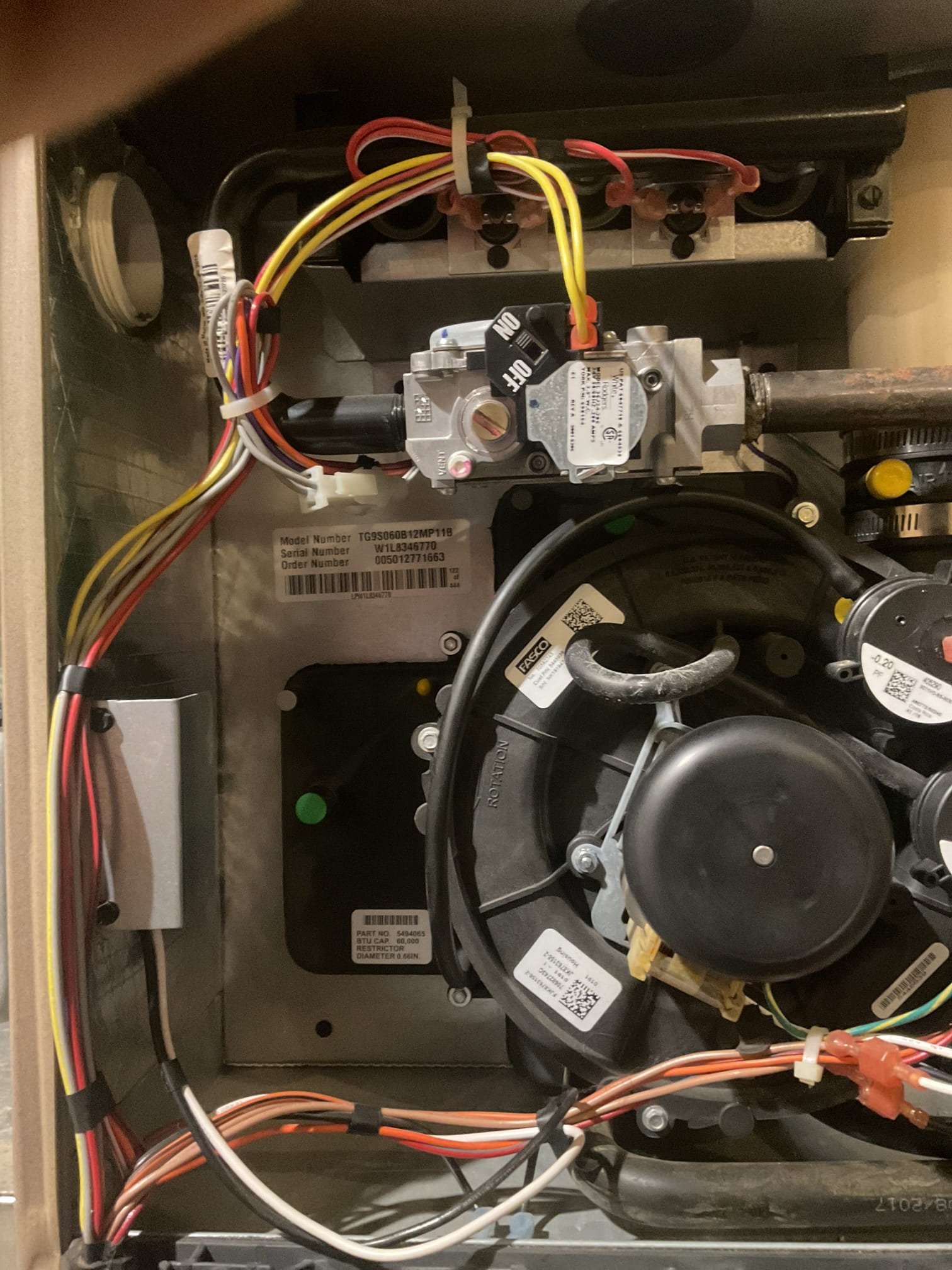 On 9/28/26, I conducted a thorough assessment of a 2018 York gas furnace experiencing a heating issue. Upon inspection, I found that only two out of the three burners were igniting. The furnace had locked out due to a flame sensor issue. I took detailed photos of the rusted and corroded burners and provided an estimate for their replacement. I measured the resistance of the high-speed ignition (HSI) and found it to be 43 ohms, which is within the acceptable range. I performed a combustion test to ensure the system was functioning correctly. Although the furnace is currently operational, it may shut down again until the burners are replaced. I recommended ordering new burners to prevent future issues. At the time of service, the furnace was working properly.