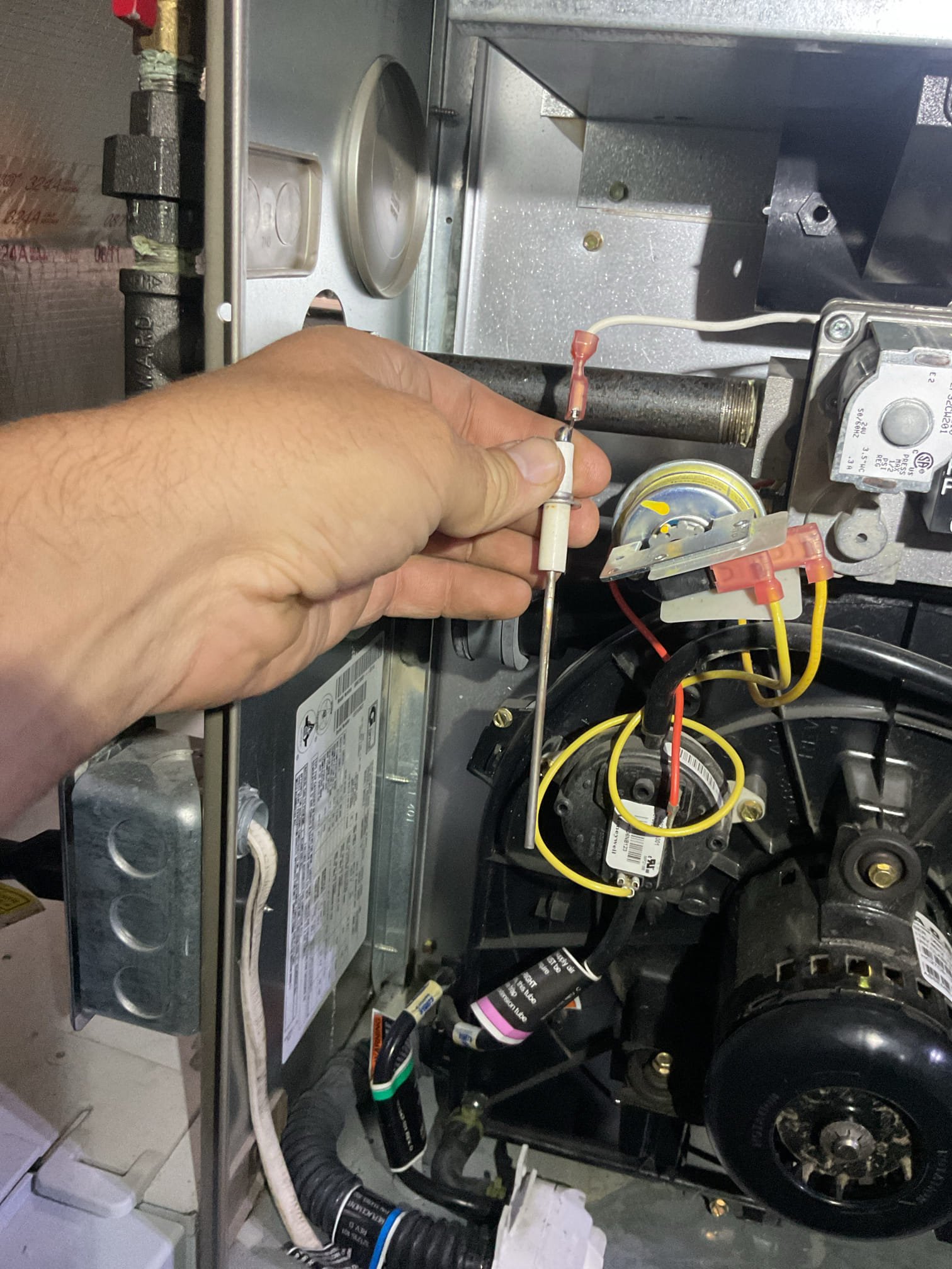 We performed a comprehensive heat tune-up for the propane furnace, which dates back to 2007. The Aprilaire 501 filter was in good condition, and we inspected the heat exchanger, burners, flue pipe, inducer assembly, and hoses. The burners showed expected corrosion due to age and fuel. We provided an email estimate for replacing the four burners. The hot surface ignitor was inspected, and flame rectification was verified. The flame sensor was cleaned, and temperature rise and static pressure were measured. We checked wiring, controls, electric motors, and components, and left an estimate for a surge protector. The mainfold gas pressure was inspected, and the drain and pump were checked. Combustion, draft, and smoke tests passed. The furnace is operating well but is beyond its life expectancy. We recommend upgrading the HVAC system and scheduled a consultation for October 9th at 10 AM.