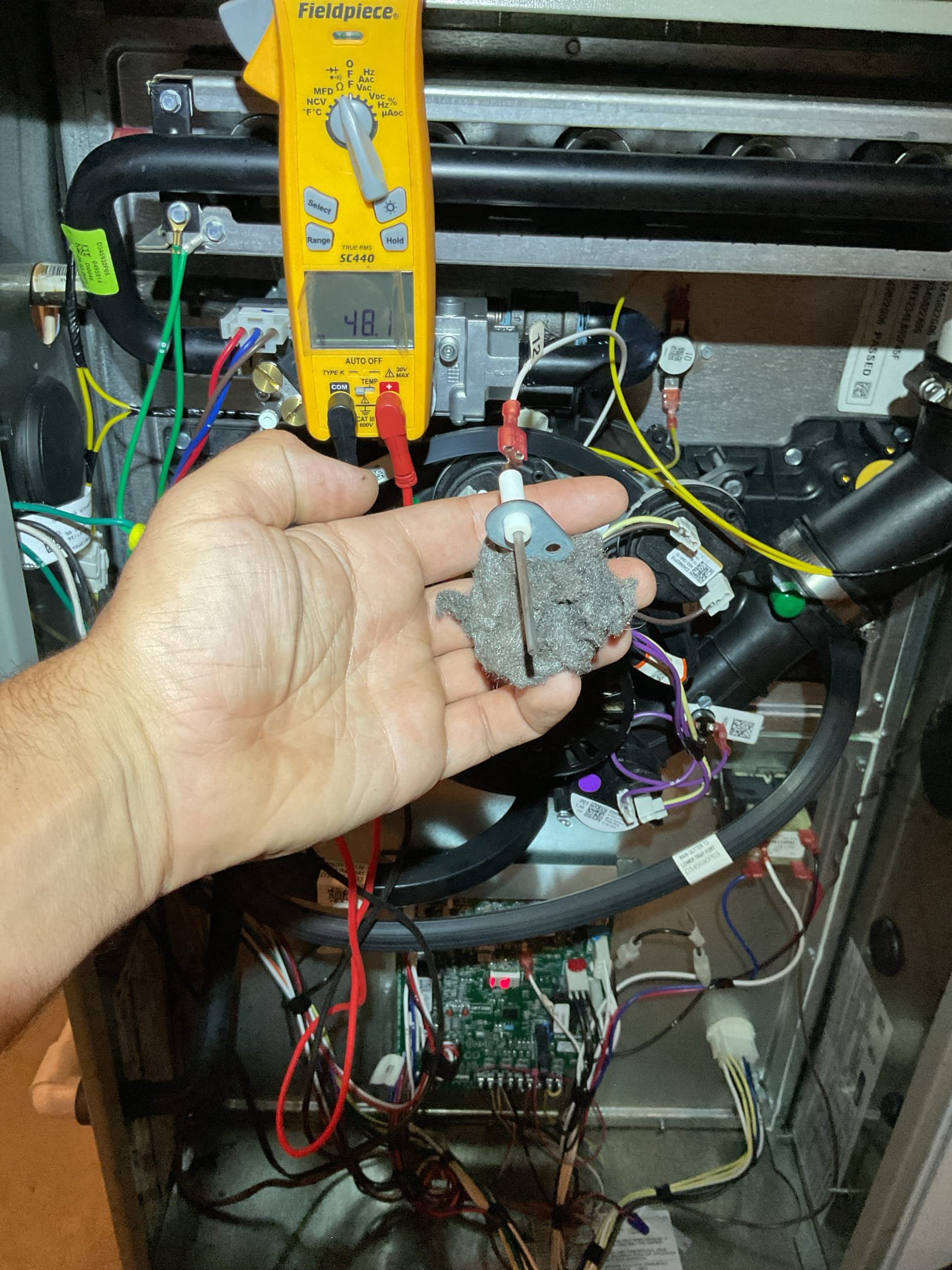 I performed a comprehensive heat tune-up on the natural gas furnace, ensuring optimal performance. I inspected the heat exchanger, burners, flue pipe, inducer assembly, and hoses. The Aprilaire 413 filter was found to be in good condition. I verified the hot surface ignitor's resistance and cleaned the flame sensor, ensuring the flame rectification circuit was functioning correctly. I measured the temperature rise and static pressure, checked all wiring, controls, electric motors, and components, and confirmed the presence of surge protection. I also inspected manifold gas pressures and drains, recommending an additional water safety switch to prevent equipment shutdown in case of water detection. The combustion, draft, and smoke tests all passed. Additionally, I completed humidifier maintenance, replacing the #10 water panel, cleaning the housing, opening the bypass damper, and setting the humidistat to 35%. The gas furnace is now operating efficiently.