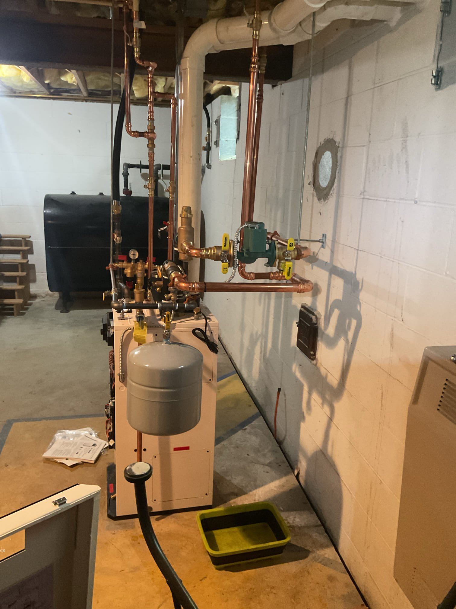 On October 2, I conducted a thorough quality assurance check on a recently installed high-efficiency propane boiler. I added a field-installed check valve to the circulating pump to prevent heat migration when the boiler is off. After repairs, I tested the boiler operation, ensuring it functioned correctly. I reviewed and adjusted various settings, including warm weather shutdown, minimum and maximum water temperatures for optimal performance. The combustion check was satisfactory, though high ambient and outdoor temperatures limited the high-stage testing. I removed an electrical jumper for the recirculating cord, which was constantly hot and not in use. The thermostat and venting systems were also checked and found to be operating correctly. The boiler is now functioning properly.