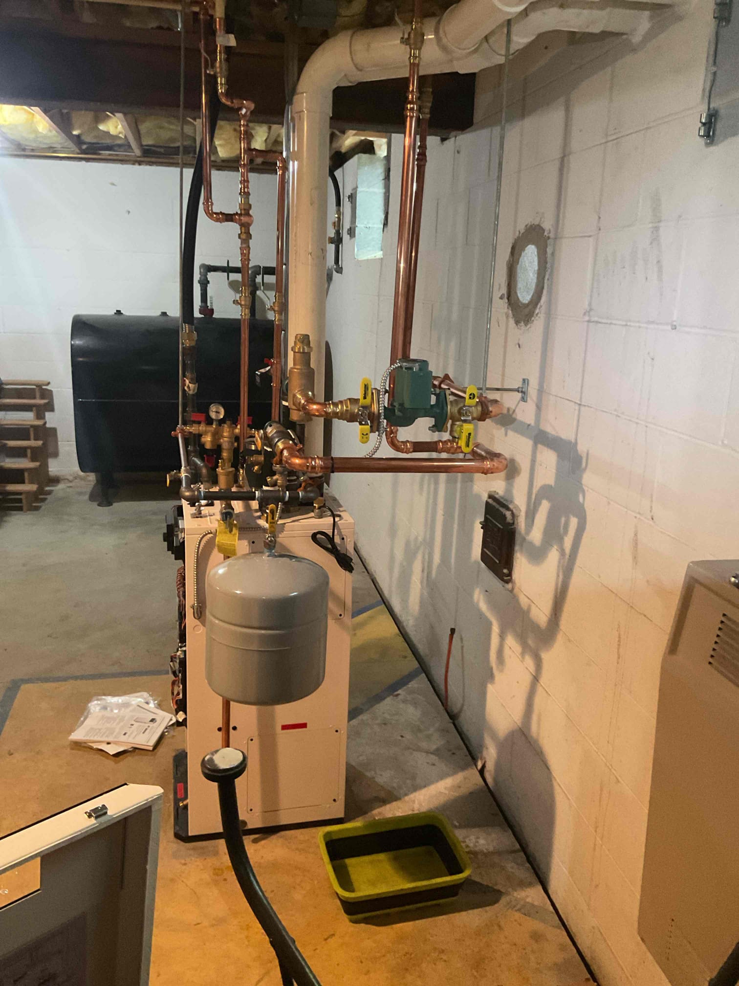 On October 2, I conducted a thorough quality assurance check on a recently installed high-efficiency propane boiler. I added a field-installed check valve to the circulating pump to prevent heat migration when the boiler is off. After repairs, I tested the boiler operation, ensuring it functioned correctly. I reviewed and adjusted various settings, including warm weather shutdown, minimum and maximum water temperatures for optimal performance. The combustion check was satisfactory, though high ambient and outdoor temperatures limited the high-stage testing. I removed an electrical jumper for the recirculating cord, which was constantly hot and not in use. The thermostat and venting systems were also checked and found to be operating correctly. The boiler is now functioning properly.