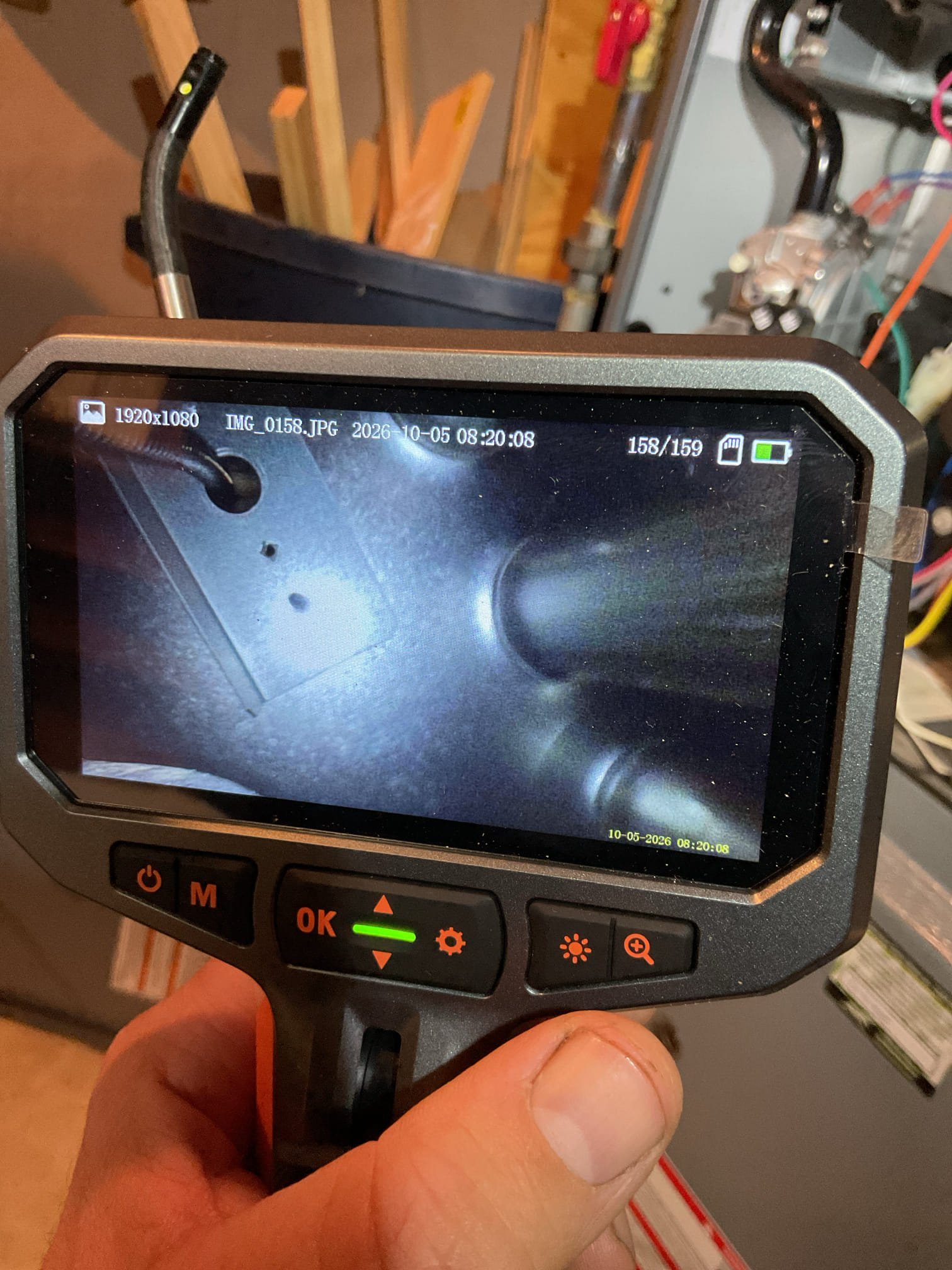 I performed a comprehensive heat tune-up on a natural gas furnace installed in March 2016. The system, now 10 years old, received a new 20x24x1 filter. I inspected the heat exchanger, burners, flue pipe, inducer assembly, and hoses. The hot surface ignitor was checked for resistance, and the flame sensor was cleaned to verify the flame rectification circuit. Temperature rise and static pressure were measured, and all wiring, controls, electric motors, and components were checked, including surge protection. Manifold gas pressure was inspected, and the drain and pump were reviewed, with a condensate pump safety noted. Additional drain/water safeties were recommended. The humidifier was maintained, and the humidity set to 35% RH. A carbon monoxide monitor was discussed, and all combustion, draft, and smoke tests passed. The furnace is operating well, though it is nearing replacement age.