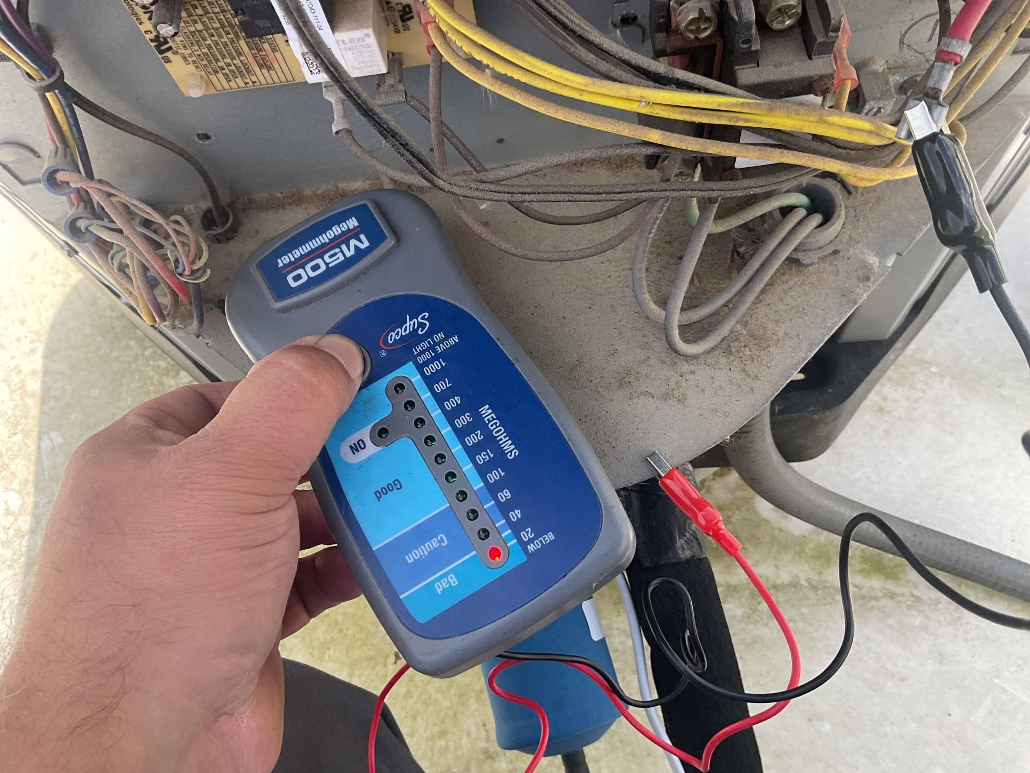 On 9/5/26, I thoroughly assessed a no-cooling issue with a 2016 Rudd heat pump system. Upon inspection, I discovered that the 30 amp double pole breaker was completely tripped and unresponsive. After climbing to the rooftop, I conducted a megometer test, confirming that the compressor was grounded. This was further verified with a meter. Given the system's age, I recommended replacing the entire heat pump. Additionally, I provided a repair estimate that included replacing the compressor, the tripped breaker, and the indoor TXV. I presented both repair and replacement options to the customer.