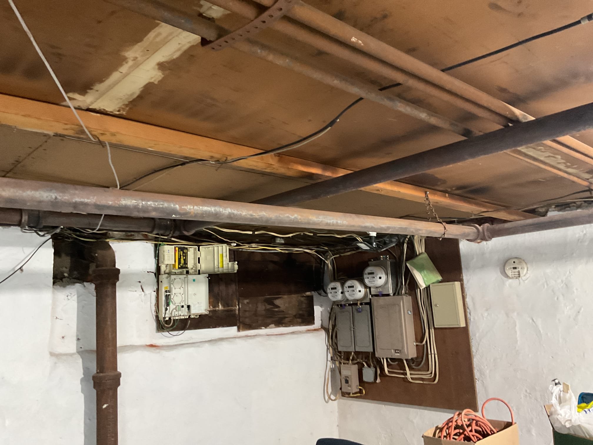 On October 7, I conducted a comprehensive heat tune-up on a Weil McLain gas steam boiler. I began by blowing down the piping to remove sediment, ensuring optimal flow. I noticed that some cast iron piping straps had loosened, so I re-secured them to the ceiling using band iron. I inspected the burners and heat exchanger for any signs of wear or damage. I discussed the boiler's performance with the homeowner, who reported that room sensors had improved its efficiency. The boiler was set at 66 degrees, so I adjusted it to 69 degrees and monitored its operation. I tested the water feeder and found it had only used 23 gallons since the last visit. A combustion test confirmed the boiler was functioning correctly.