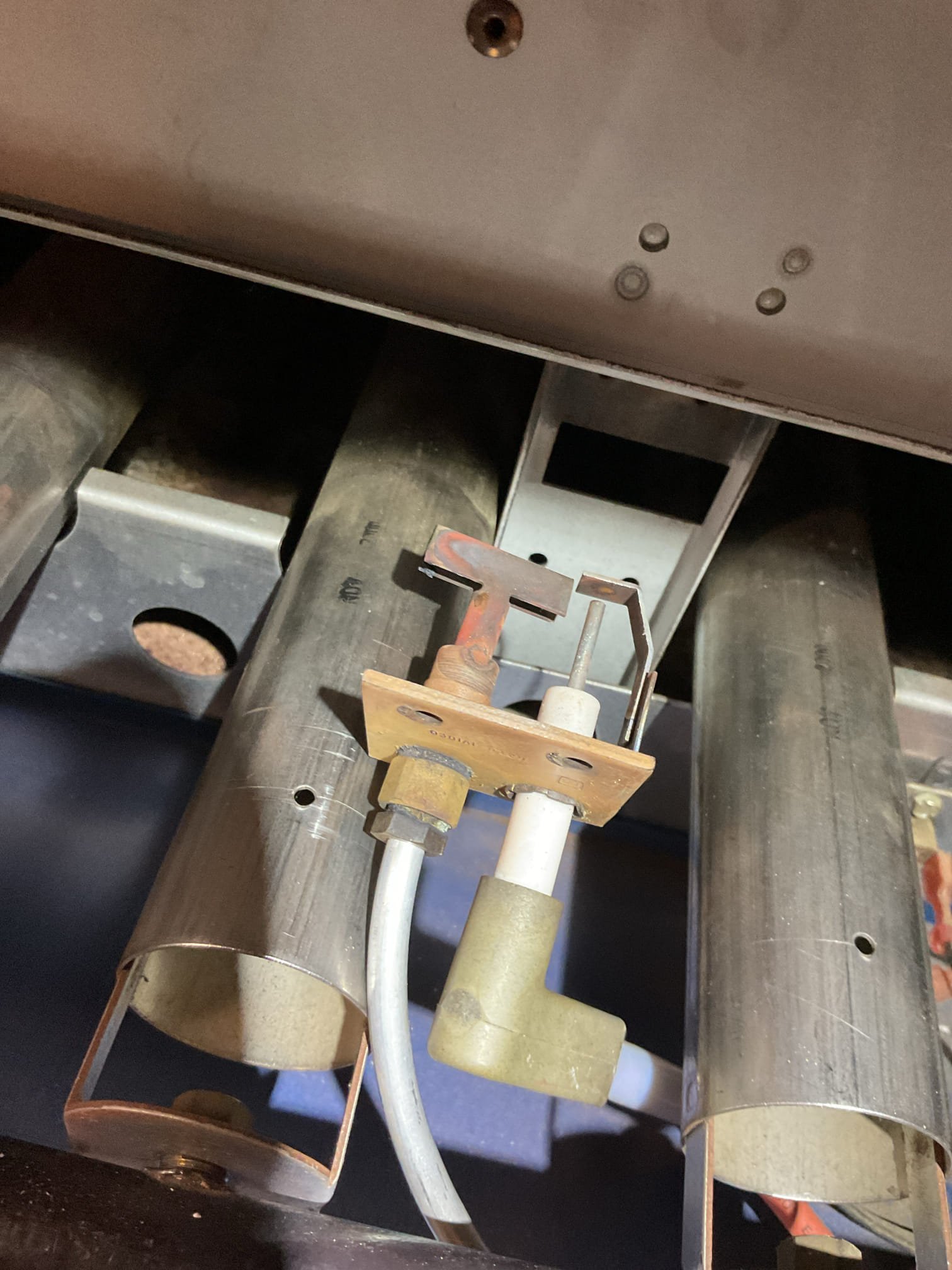 I performed a comprehensive heat tune-up on a 21-year-old natural gas boiler. I inspected the flues and chimney, finding minimal debris. The heat exchanger and burners were clean, and I cleaned the burner compartment. The pilot assembly showed a blue flame with an orange tip, indicating good performance. I also checked the hydraulic components, including the air eliminator, feed valves, expansion tank, and circulator, all of which were in good condition. Wiring controls and components were verified, and the boiler has surge protection. I provided estimates for a low-level carbon monoxide detector and a WiFi+Audible water sensor. Combustion and draft tests passed, and the system is operating well. The homeowner renewed their service plan today.