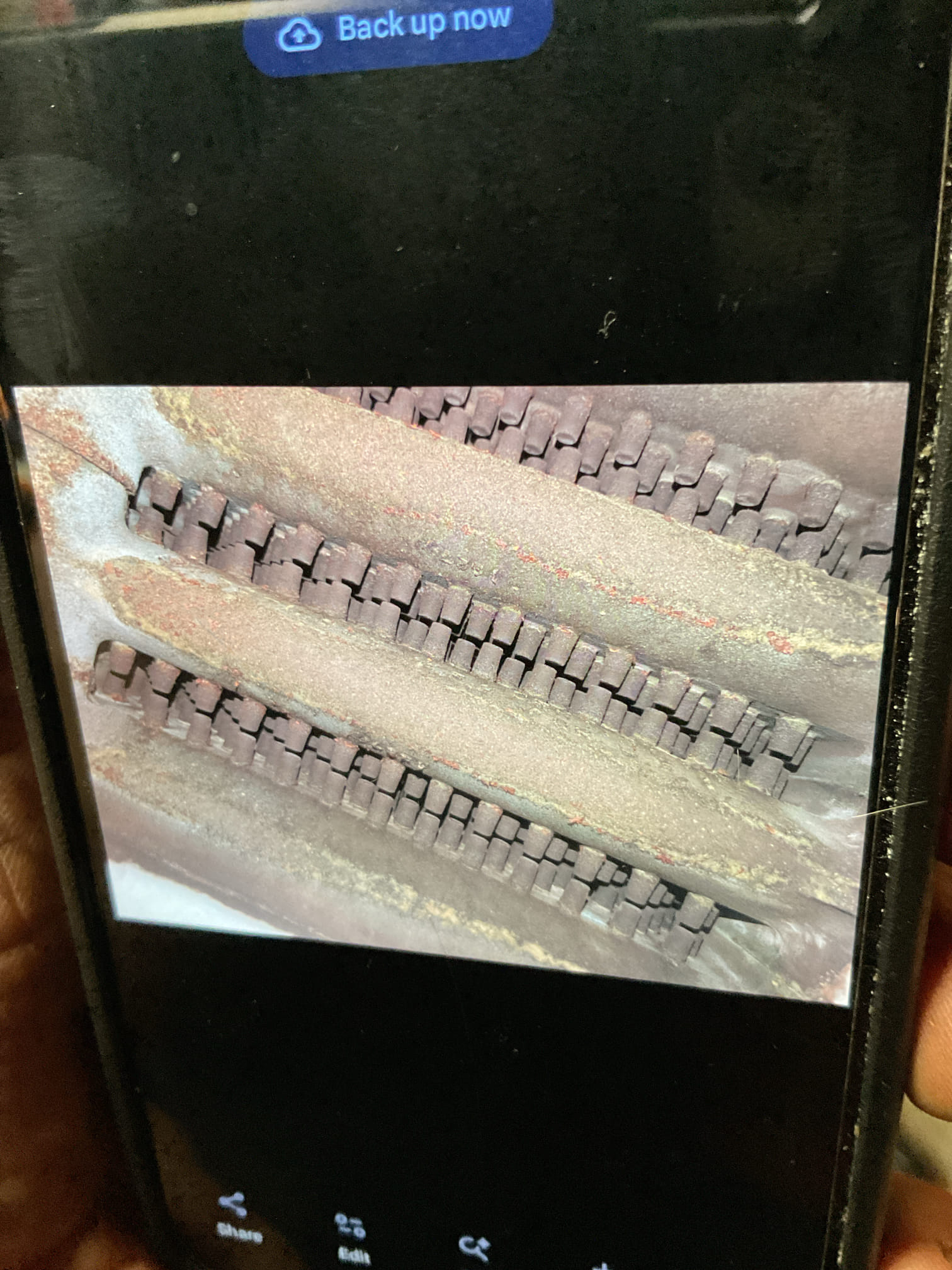 I performed a comprehensive heat tune-up on a 21-year-old natural gas boiler. I inspected the flues and chimney, finding minimal debris. The heat exchanger and burners were clean, and I cleaned the burner compartment. The pilot assembly showed a blue flame with an orange tip, indicating good performance. I also checked the hydraulic components, including the air eliminator, feed valves, expansion tank, and circulator, all of which were in good condition. Wiring controls and components were verified, and the boiler has surge protection. I provided estimates for a low-level carbon monoxide detector and a WiFi+Audible water sensor. Combustion and draft tests passed, and the system is operating well. The homeowner renewed their service plan today.
