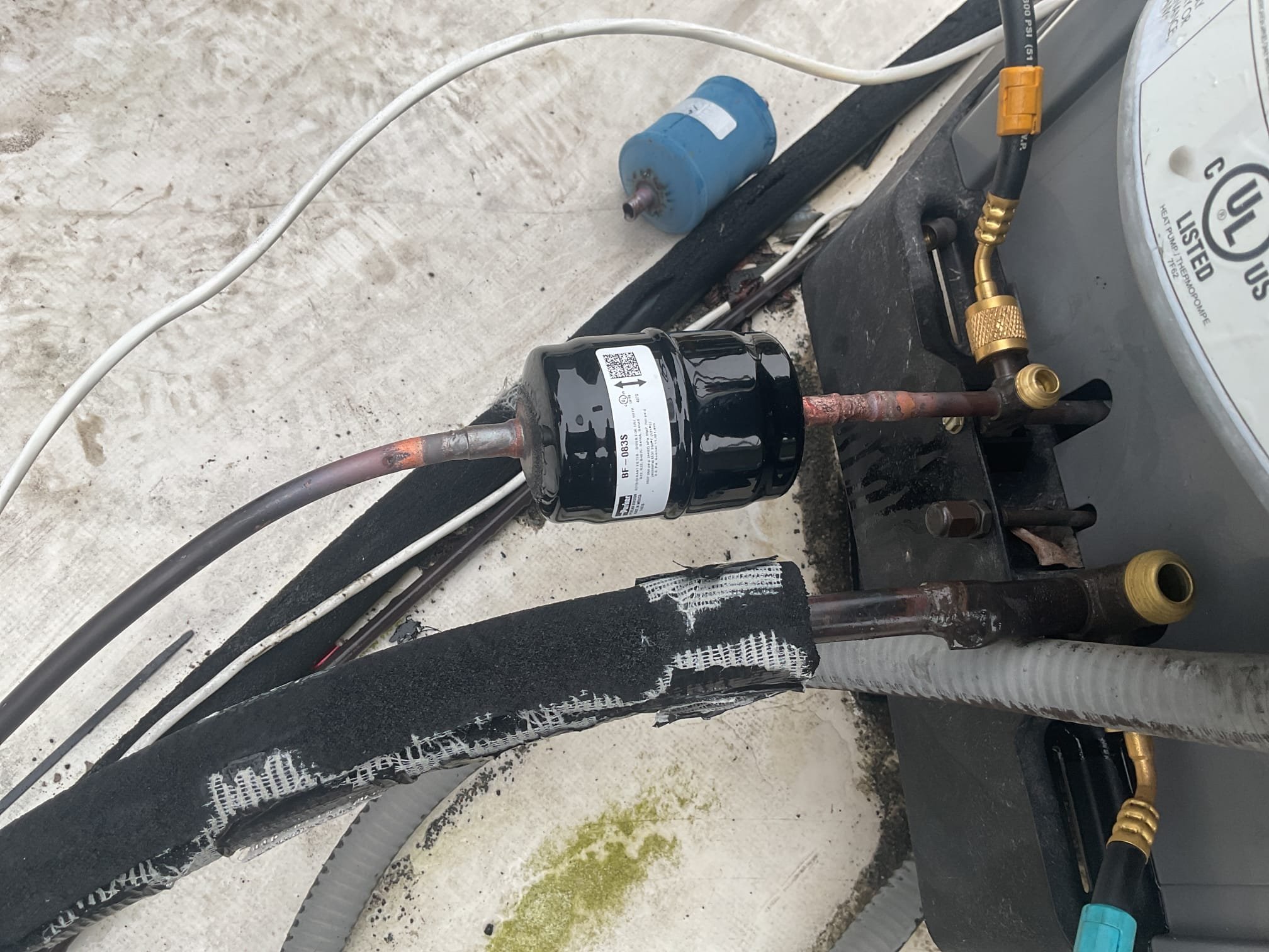 On October 16, I began by pulling the refrigerant charge back into the system. I then replaced the filter dryer and the indoor thermal expansion valve (TXV). After ensuring the system was properly sealed, I conducted a pressure test using 300 psi nitrogen and soap solution. The system was then vacuumed down to 470 microns. Following this, I released the charge and added 10 ounces of 410A refrigerant provided by the customer. The R410A pressures were recorded at 250/115 with 6 degrees of subcooling and 12 degrees of superheat. The temperature split was checked and found to be 18 degrees. The air conditioning system is now functioning properly.