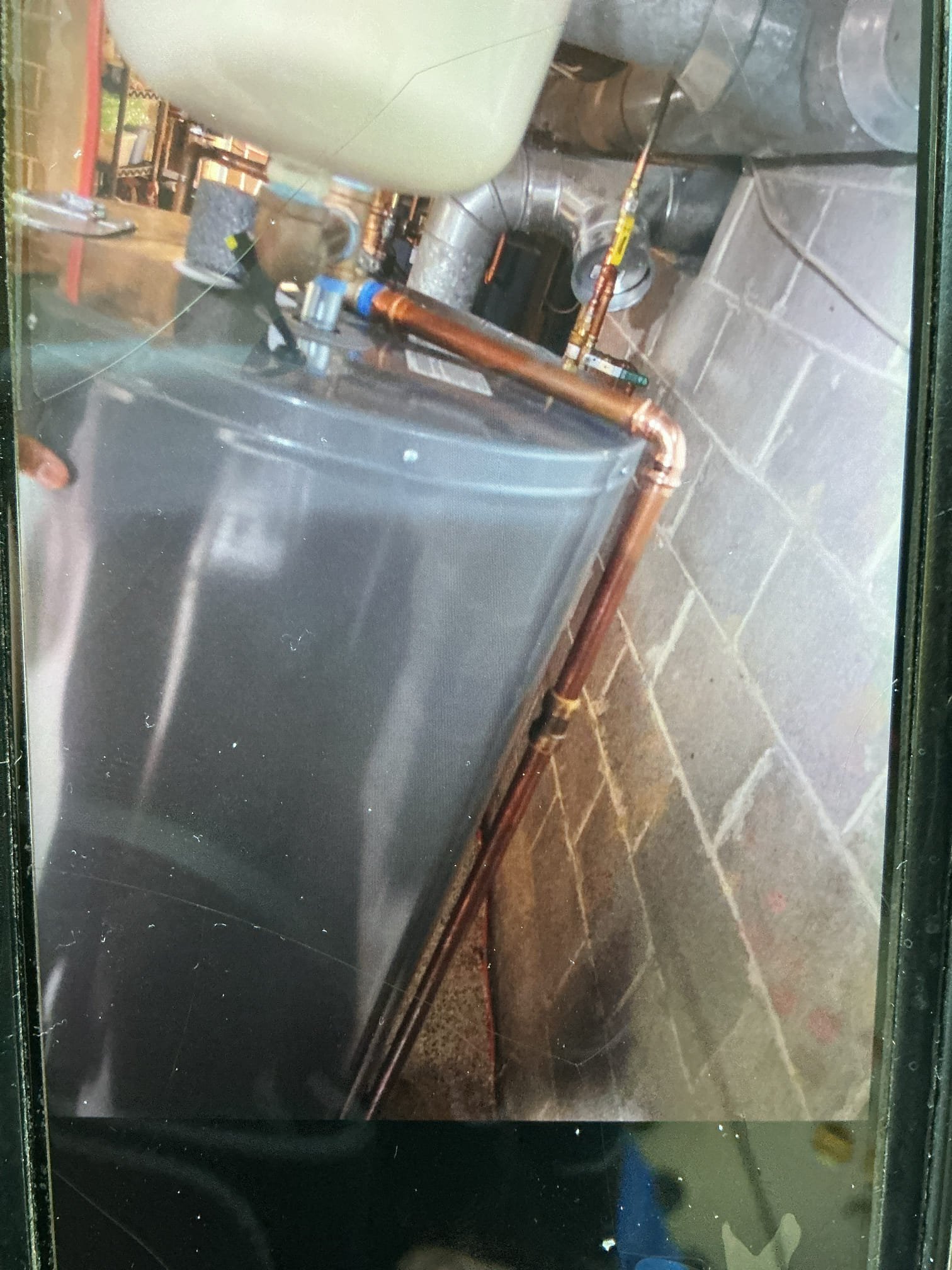On October 16, I inspected an electric water heater due to a noise complaint. The water sensor was triggering, and there was water in the drain pan. I verified the water tank, pressure relief valve, and expansion tank, all of which were functioning correctly. The relief valve showed signs of water leakage, so I replaced it under warranty. I also checked the water pressure, which was at 45 psi, and ensured the water flow was normal. No charge was applied due to the warranty.