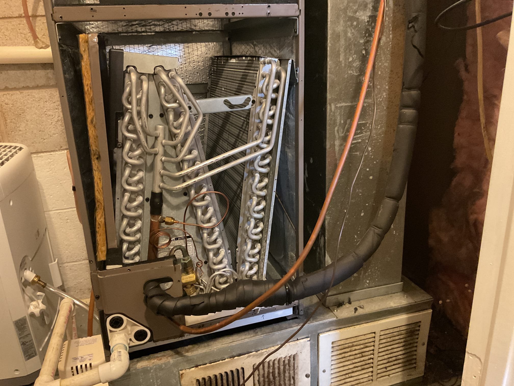 On 10/21/26, I conducted a comprehensive heat tune-up on a 2018 Coleman heat pump system. I began by replacing the 16x20x1 air filter to ensure optimal airflow. Next, I meticulously checked all electrical connections and components to verify their integrity and functionality. I tested the emergency heat feature to confirm it was operational. Additionally, I measured refrigerant pressures and temperatures to ensure they were within the manufacturer's specifications. Capacitors were tested for proper functionality. During the inspection, I discovered the absence of a trap on the condensation line, which I recommended to be replaced with an EZ Trap for efficient drainage. The heat pump system was fully operational at the time of service.