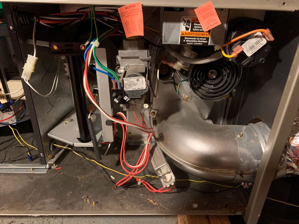 In Redwood City, California this afternoon performing a furnace maintenance for the Combstack residence.