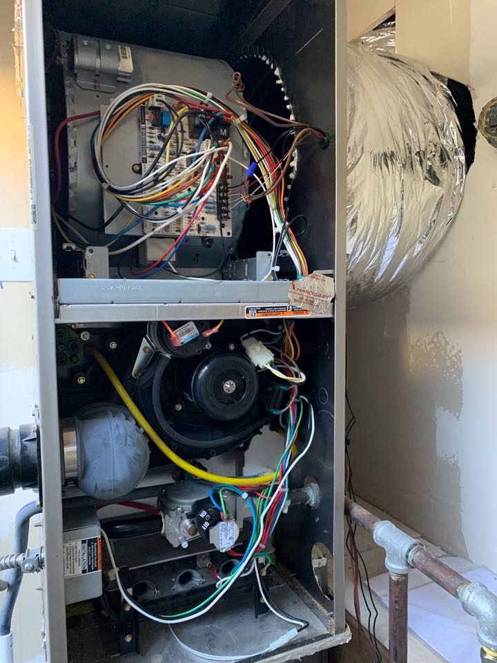 In Oakland, California this afternoon performing a furnace maintenance for the Beard residence. 