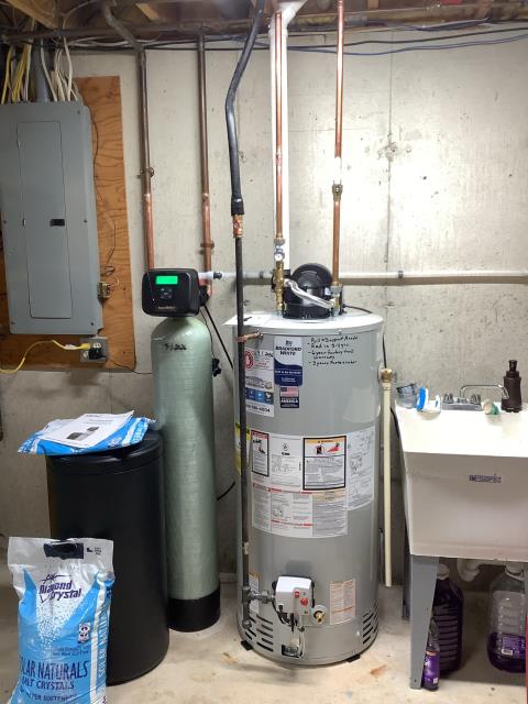 Install 50 gallon natural gas power vent water heater. Also install mixing valve on water heater. Install 32,000 grain Water softener. 