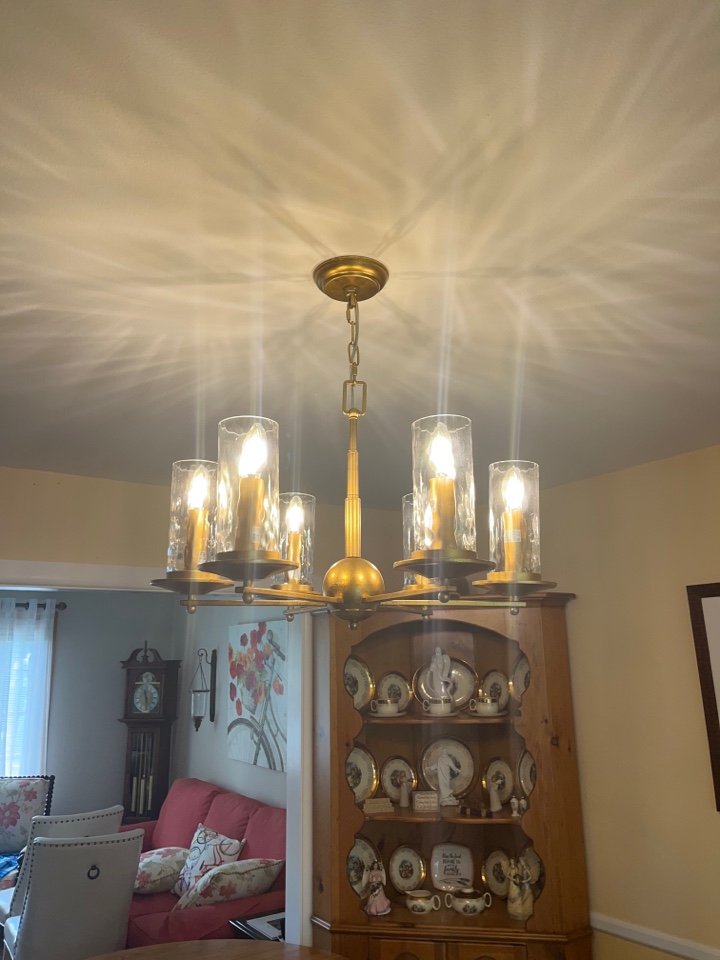 Replaced light fixture over dinning room table with chandelier in Pasadena Maryland