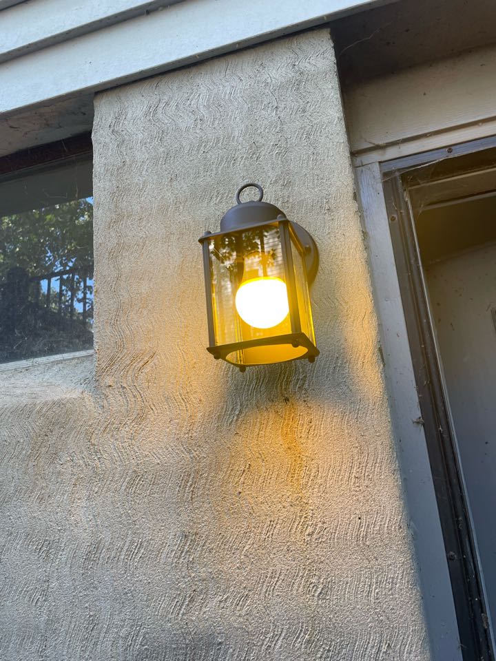 Replaced outside light fixture and ivory switch located in basement area. Millersville, MD. 