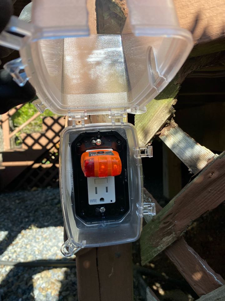 Installed outdoor GFCI and in-use cover, and one switch and GFCI combination device in Glen Burnie, MD