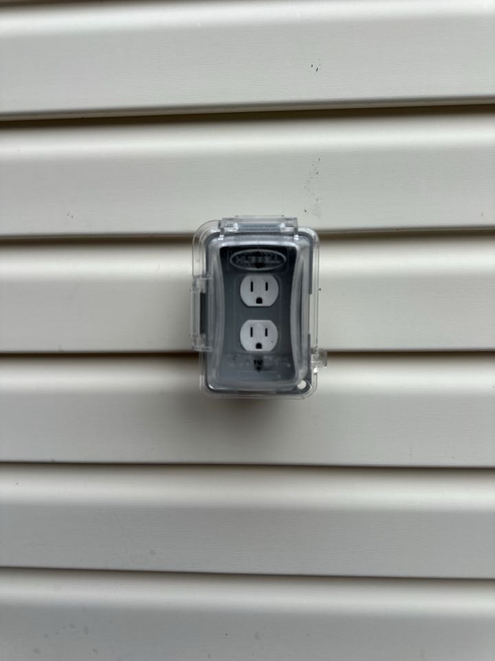 Installed flush mount ceiling light and outdoor duplex receptacle with in-use cover in Pasadena, MD. 