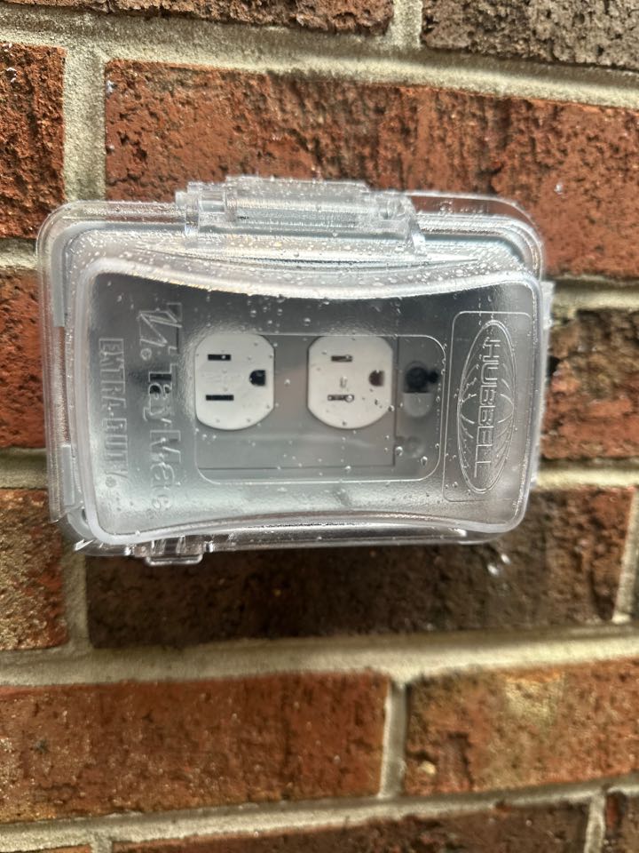Installed outdoor rated outlet with bubble cover in Parkville, MD. 