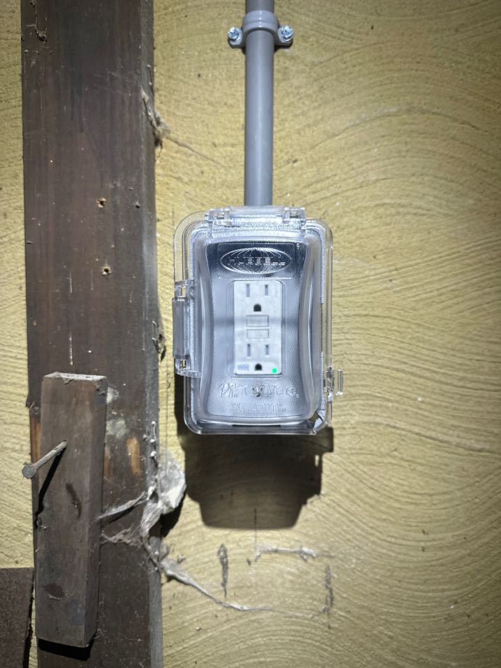 Installed outdoor GFCI receptacle with in-use cover in Severna Park, MD. 