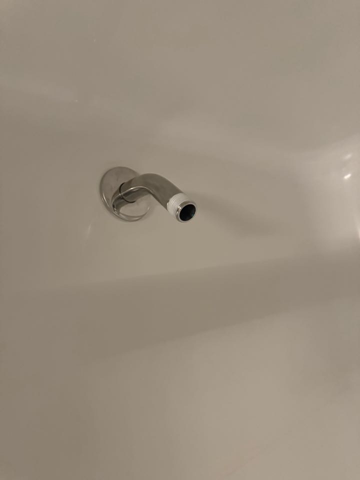 Removed a broken piece of a shower extension arm  and flush hot water faucet line, cleaned the pop up  stopper 