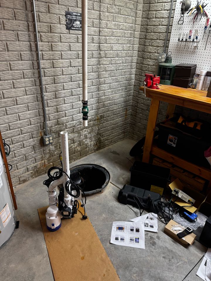Power vented water heater and a battery backup sump pump system installed.
