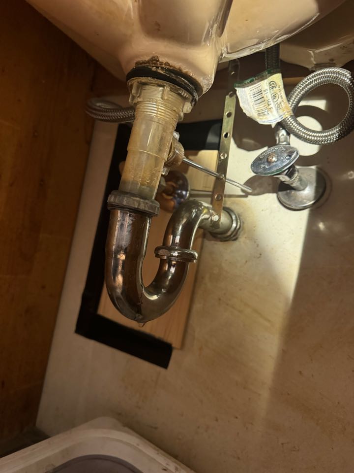 Broken bathroom sink drain and corded galvanized pipe 