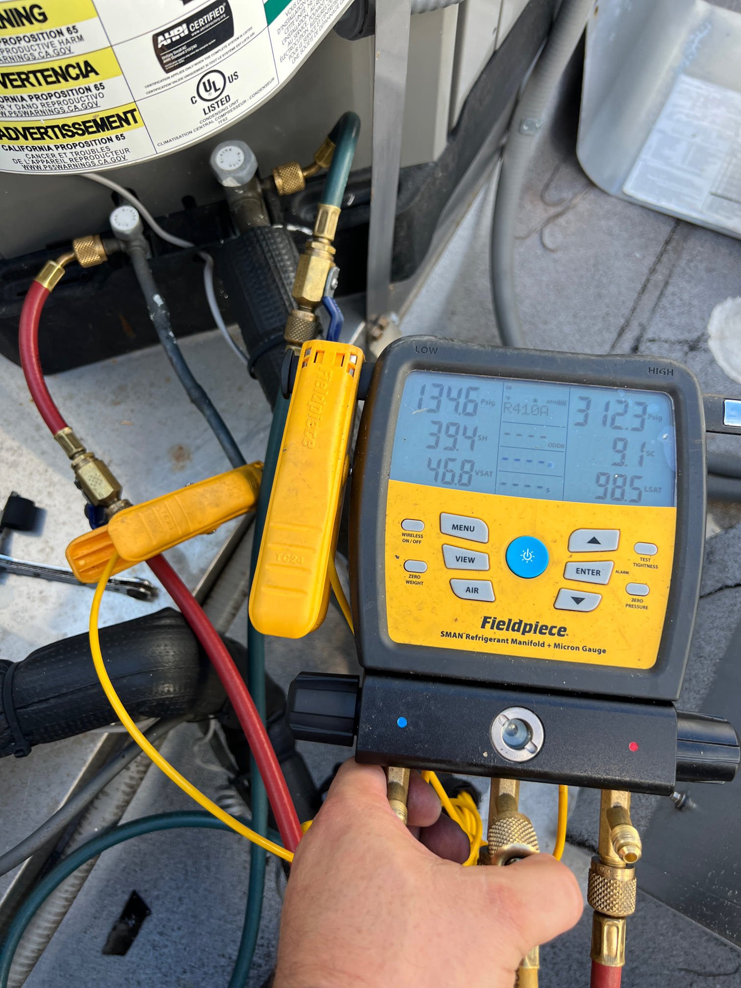I am a highly skilled and experienced home service professional. I arrived at the customer's home and found that the customer had cleared the drain prior to my arrival. I checked the drain coil safety switch and found that it had water in it. I cleaned out the water and checked the pressures, which were good. I then checked the system and found that it was cooling properly.