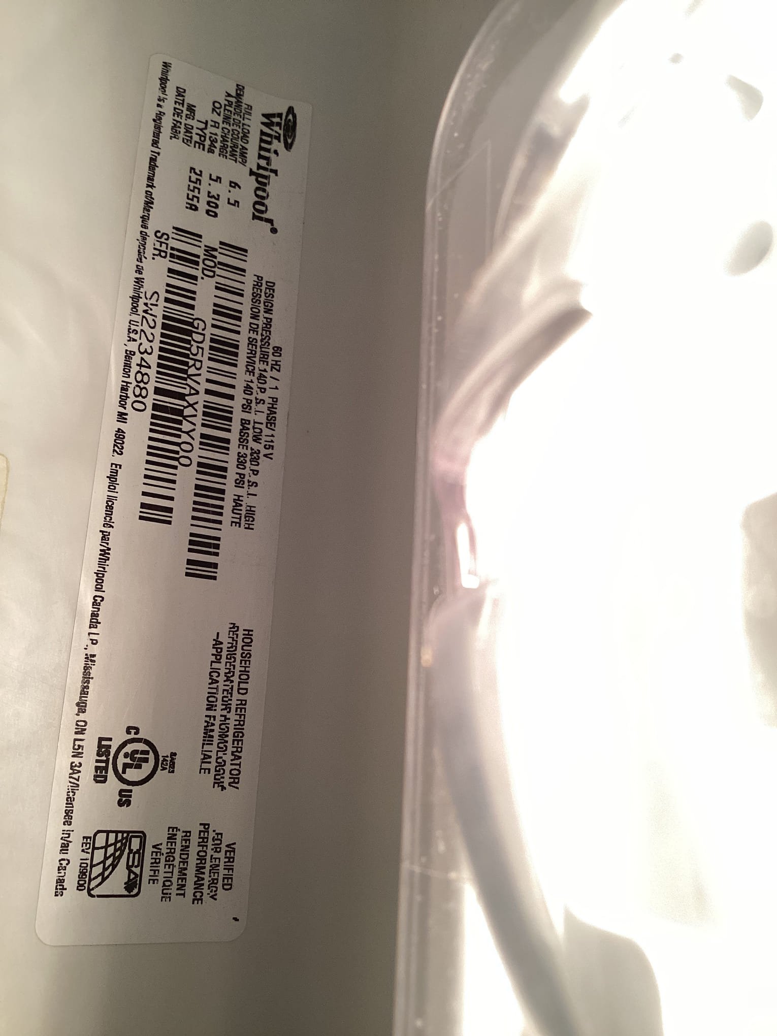 The unit is in a small humid kitchen with grocery bags blocking the return air flow. As a result, the still air is frosting and blocking air vents.