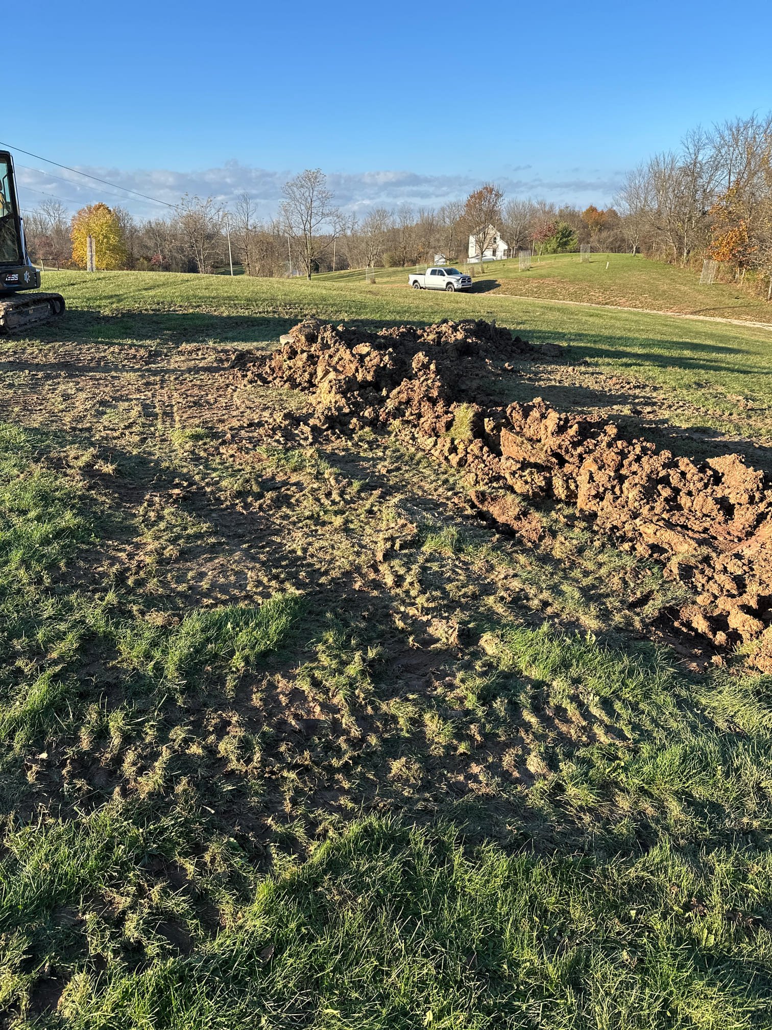 The scope of work includes excavation, the removal of the existing bed system pipe, and the installation of new piping. A 15-year warranty will be provided for the direct work performed. It is important to note that any issues arising from components related to the wall pump or other factors after the completion of the excavation project will require a change order to address.