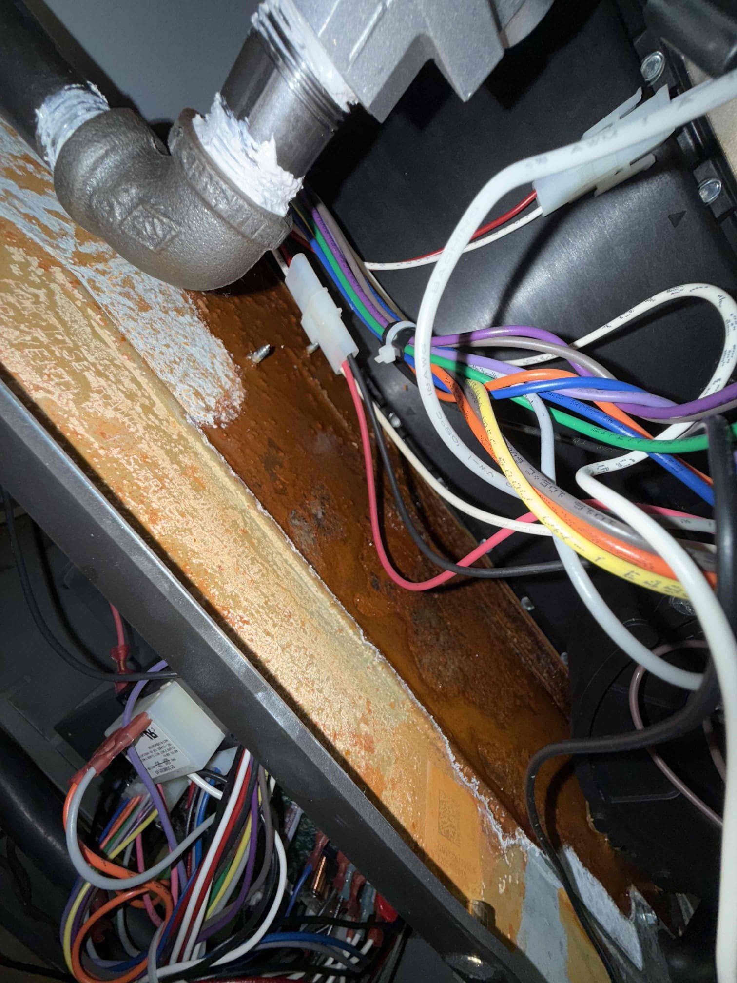 I am a highly skilled and experienced home service professional. Recently, I received a call from a customer who was experiencing issues with their heating and cooling system. Upon inspection, I discovered that the collector pan was leaking water, which had been a problem for some time. The unit was also starting to rust out badly. I explained to the customer that this was a factory issue and not related to my work. I offered to replace the collector pan, but the customer declined, stating that they wanted to wait until the warranty expired. I informed the customer that the warranty would not cover the issue, and that they should contact the manufacturer directly to address the problem.