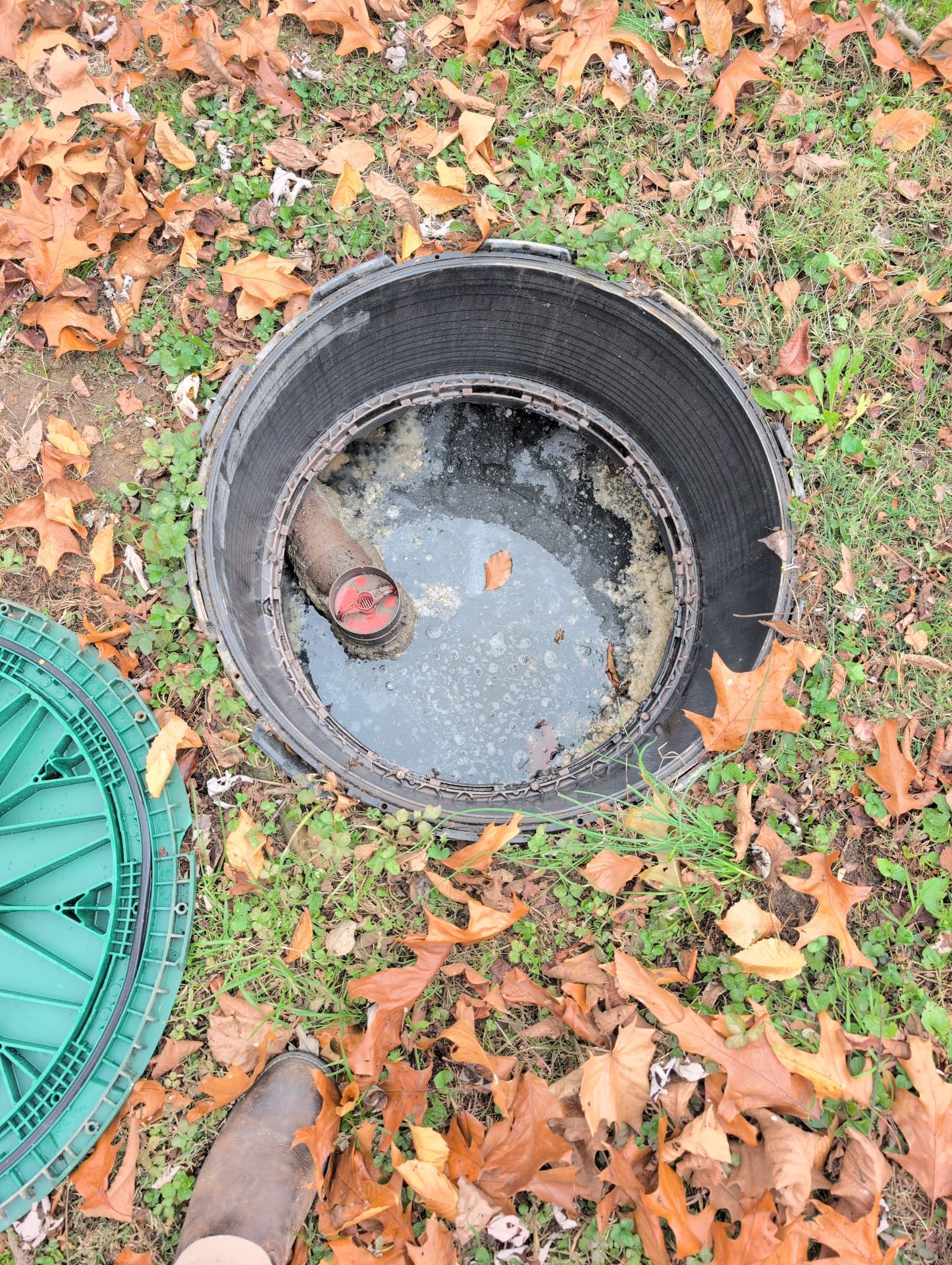 I was called to a home for a clogged toilet. The client had been experiencing the issue for about two weeks. I arrived and found that the client had already attempted to snake the toilet, but it did not work. I suspected that the clog was in the septic tank, so I informed the client that we would need to take the septic lids off to observe the water flow to the septic tank. Upon removing the septic lids, I noticed that the septic tank was extremely full and needed to be pumped out. I recommended that the client contact a third-party septic company to pump the tank and then have us come back to ensure that the drain lines were not damaged or bellied.