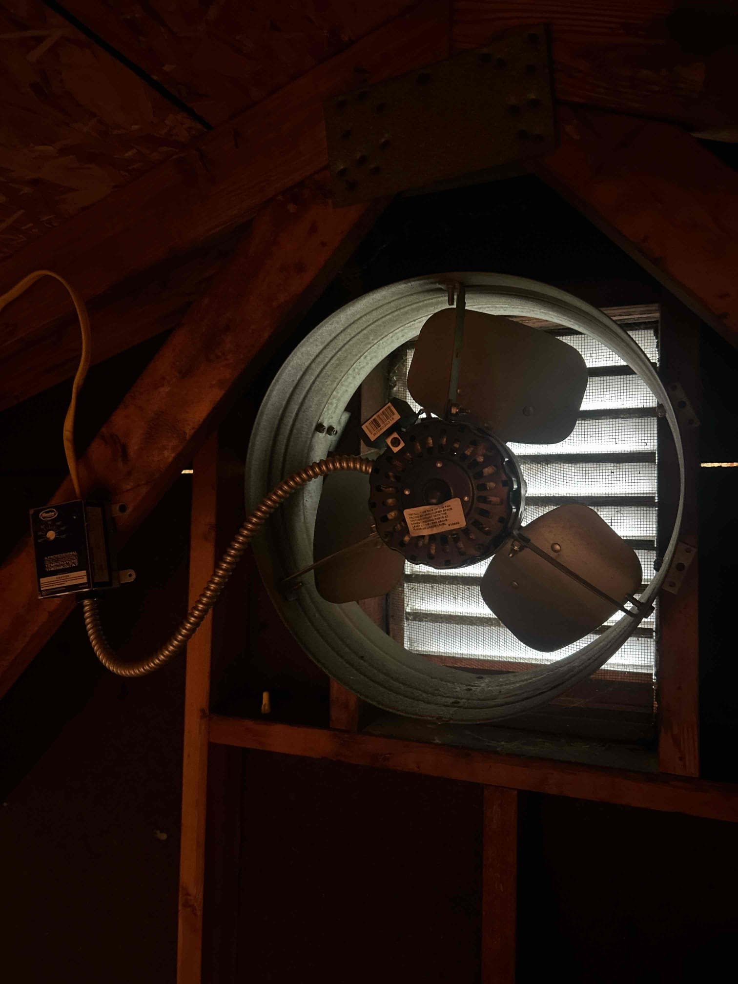 The customer is currently comparing quotes for a home service project. The project includes the installation of a new attic fan and venting of a bath and range hood outside the house. The customer is considering the cost of the labor and materials for the project.