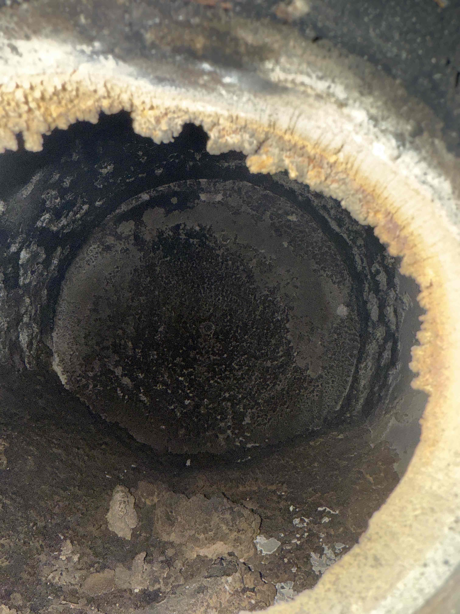 The system was not operating properly, and the burner cavity and flue were full of unburned oil and debris. I was called to the site to clean out the burner cavity and flue, which was a time- and material-intensive job.