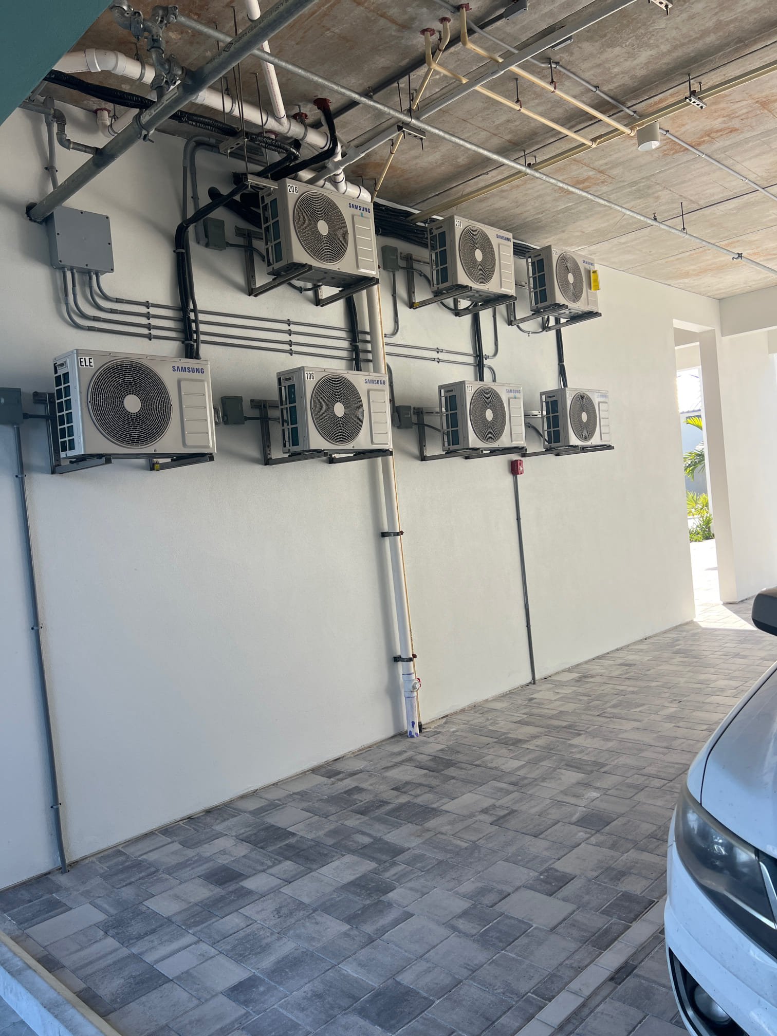 I am a highly skilled home service professional. I recently completed a job that involved installing 55 heads, 34 mini splits, and 1 split system. The customer requested that I provide extra parts on hand in case of any issues. All the stats were wired, and the customer also requested that the outdoor units be hosed off and the drains sucked out. The hose bibs and hoses were in each bay.