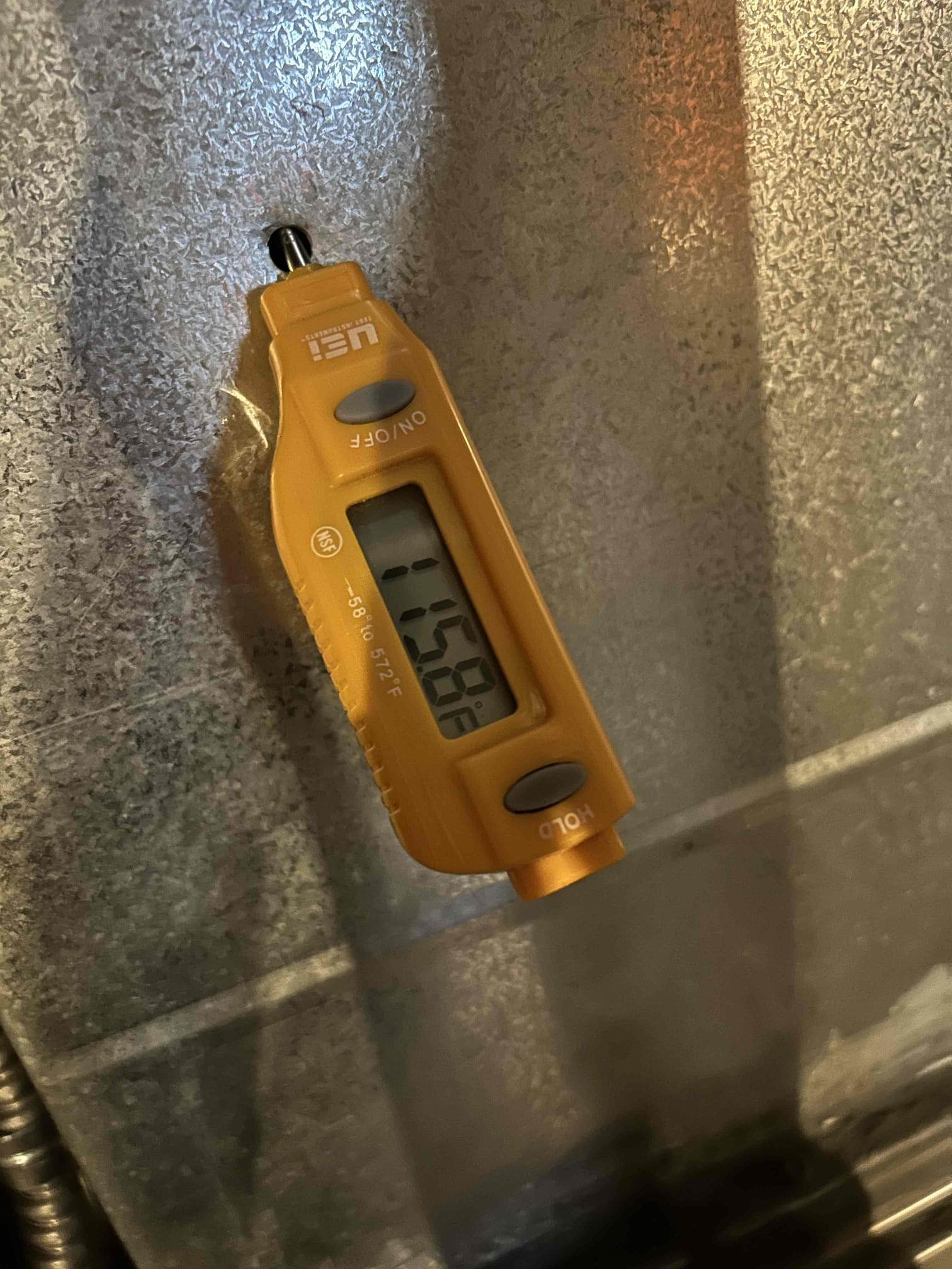 Condensate drain line sloped backward. Building water & tripping pressure switch. Unit up & running 