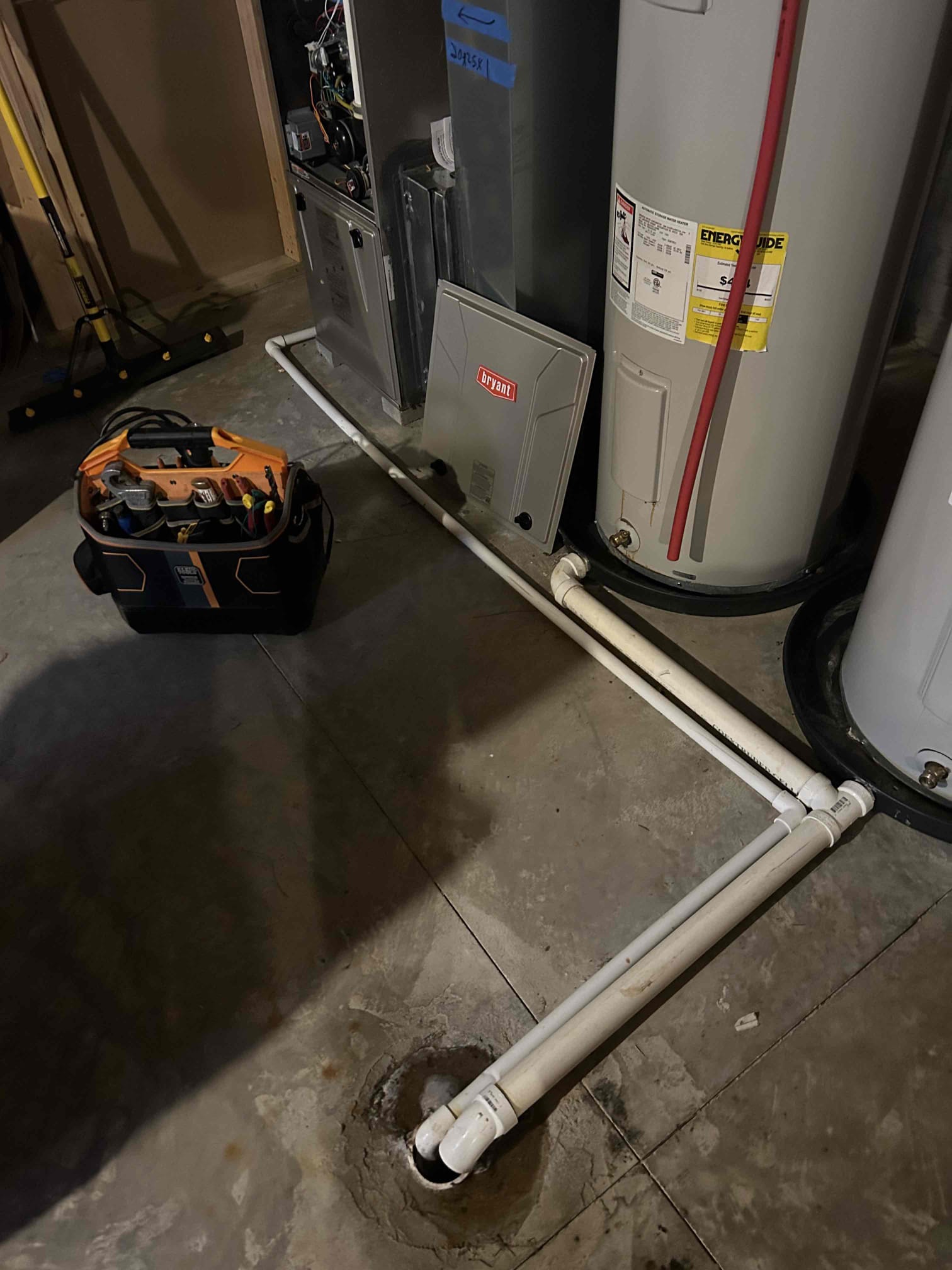 Condensate drain line sloped backward. Building water & tripping pressure switch. Unit up & running 