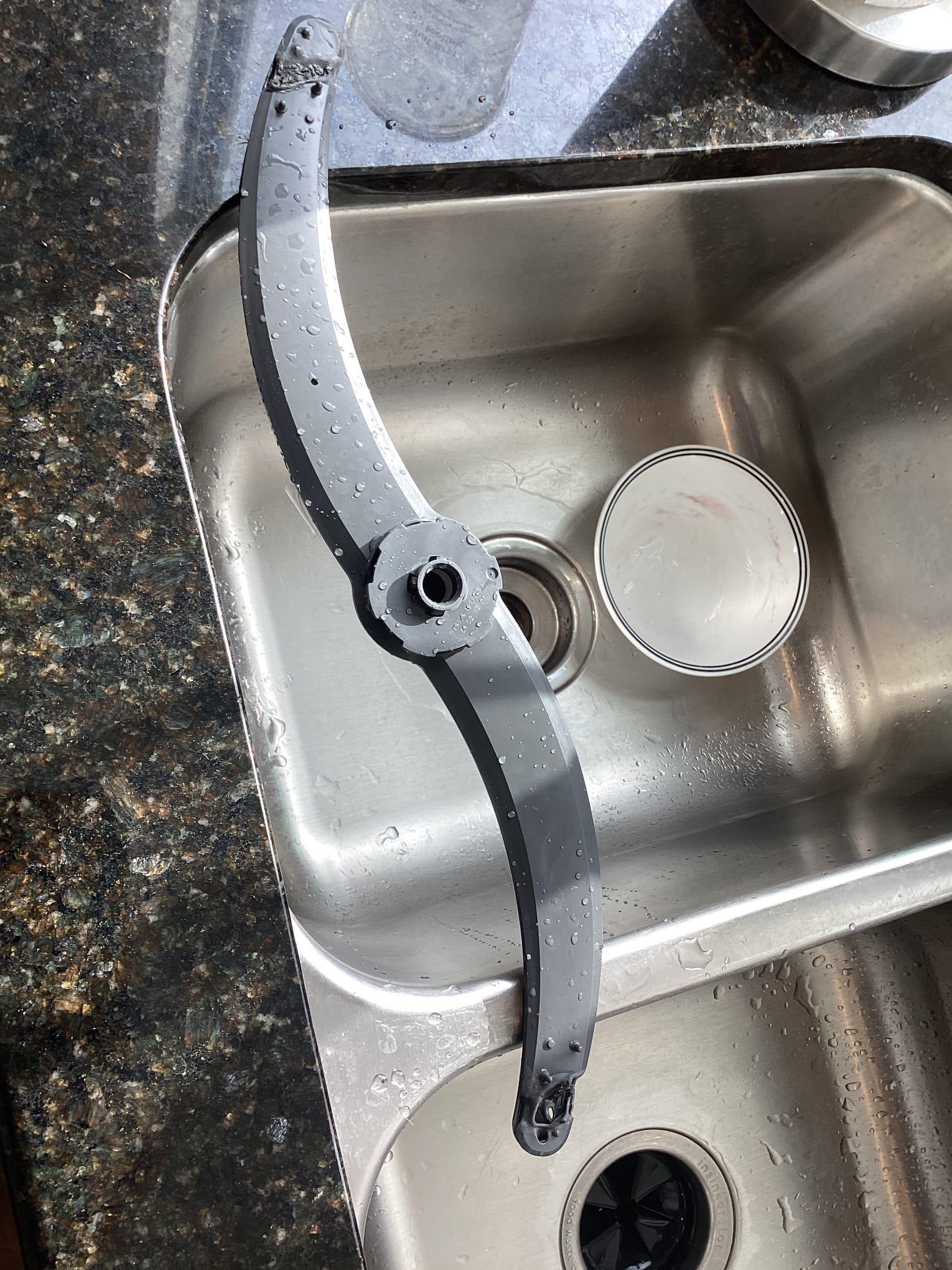 Upon inspection, it was determined that the dishwasher's bottom spray arm had suffered significant damage, causing it to malfunction. The spray arm was found to be melted, resulting in an improper water distribution pattern. This issue led to water being directed straight at the gasket, causing it to deteriorate and ultimately leak. As a result, the dishwasher was unable to function correctly. I informed the customer of the situation and recommended that they order a replacement spray arm. The customer decided to replace the spray arm themselves, and I ensured they understood the importance of proper installation to prevent future issues.