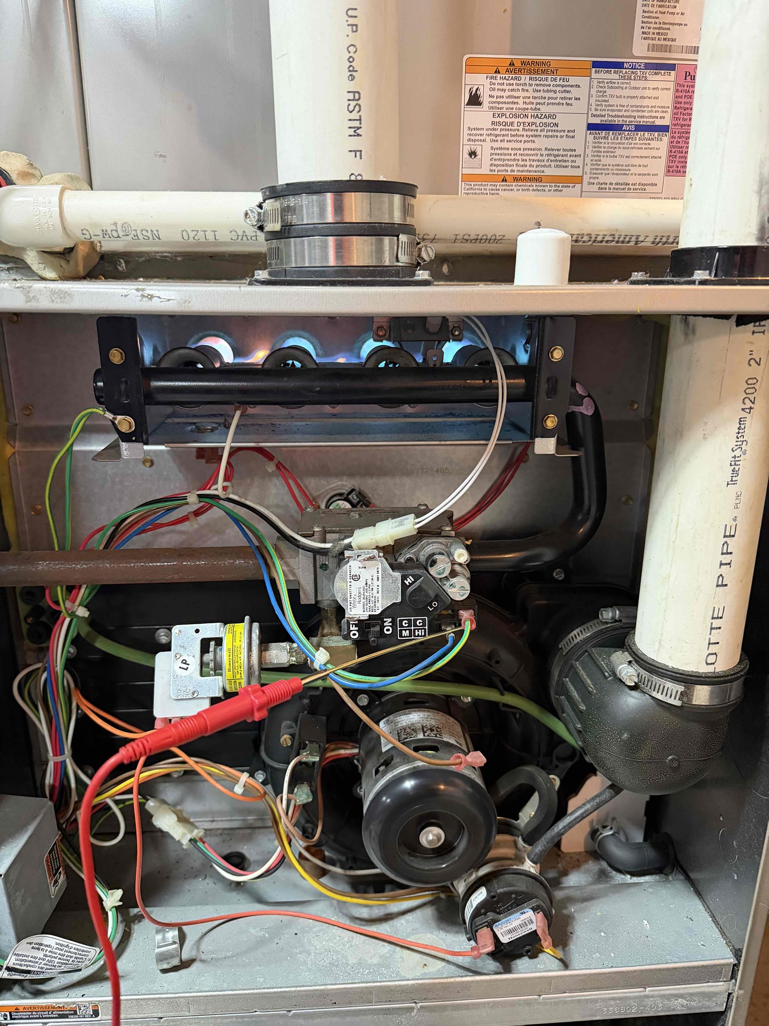 I responded to a furnace issue where the gas valve wasn't opening. Tapping and warming the valve resolved the problem temporarily. However, high carbon monoxide levels were detected due to rust in the heating exchanger. After adjusting gas pressures, the levels normalized. Given the valve's failure, I recommend replacing it to prevent future issues. The system is operational, but proactive measures are advised to avoid further disruptions.