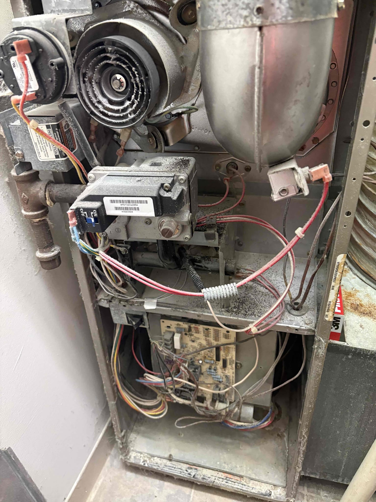 Upon arrival, I assessed the unit and identified a grinding noise originating from the inducer motor. After a thorough inspection, I confirmed that the system was operating correctly, but the noise was excessive. I took a CO2 reading in the supply duct in the bathroom, which showed 0 ppm, indicating proper ventilation. The flame sensor was dirty, so I cleaned it using sandpaper. Considering the unit's age and condition, I recommended a furnace replacement. I provided an estimate for the replacement and filled out a parts order form for a new inducer motor, although I did not recommend repairing it due to the unit's overall condition. I also applied a military discount to the replacement estimate.