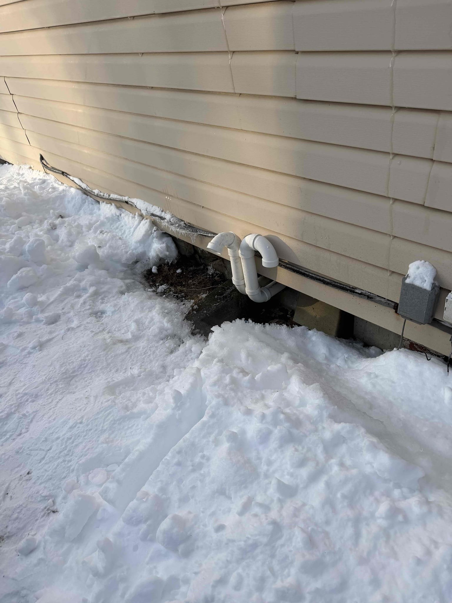 I conducted a thorough furnace inspection, starting with a detailed examination of the exhaust pipe. Adjustments were made to prevent freezing, ensuring optimal performance. The intake was reconfigured to draw air from the basement instead of outside, providing a temporary solution. I also cleared any blockages in the drains to maintain efficient drainage. Throughout the process, I verified that the system was operating correctly, checking all components for proper function. The furnace was left in a fully operational state, ready for continued use.