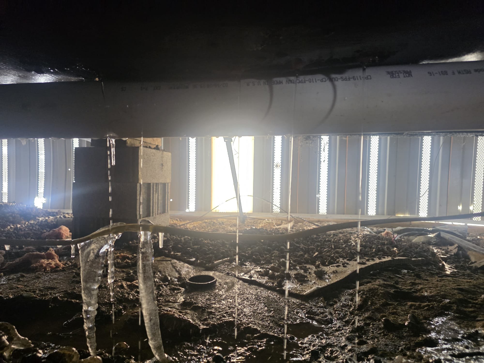 I attempted to unthaw the frozen water lines for an hour and a half, but they remained frozen. Upon further inspection, I identified the split in the CPVC water lines, which were leaking. I carefully examined the affected area to determine the extent of the damage. After assessing the situation, I provided a detailed estimate for the necessary repairs, ensuring all potential issues were addressed.