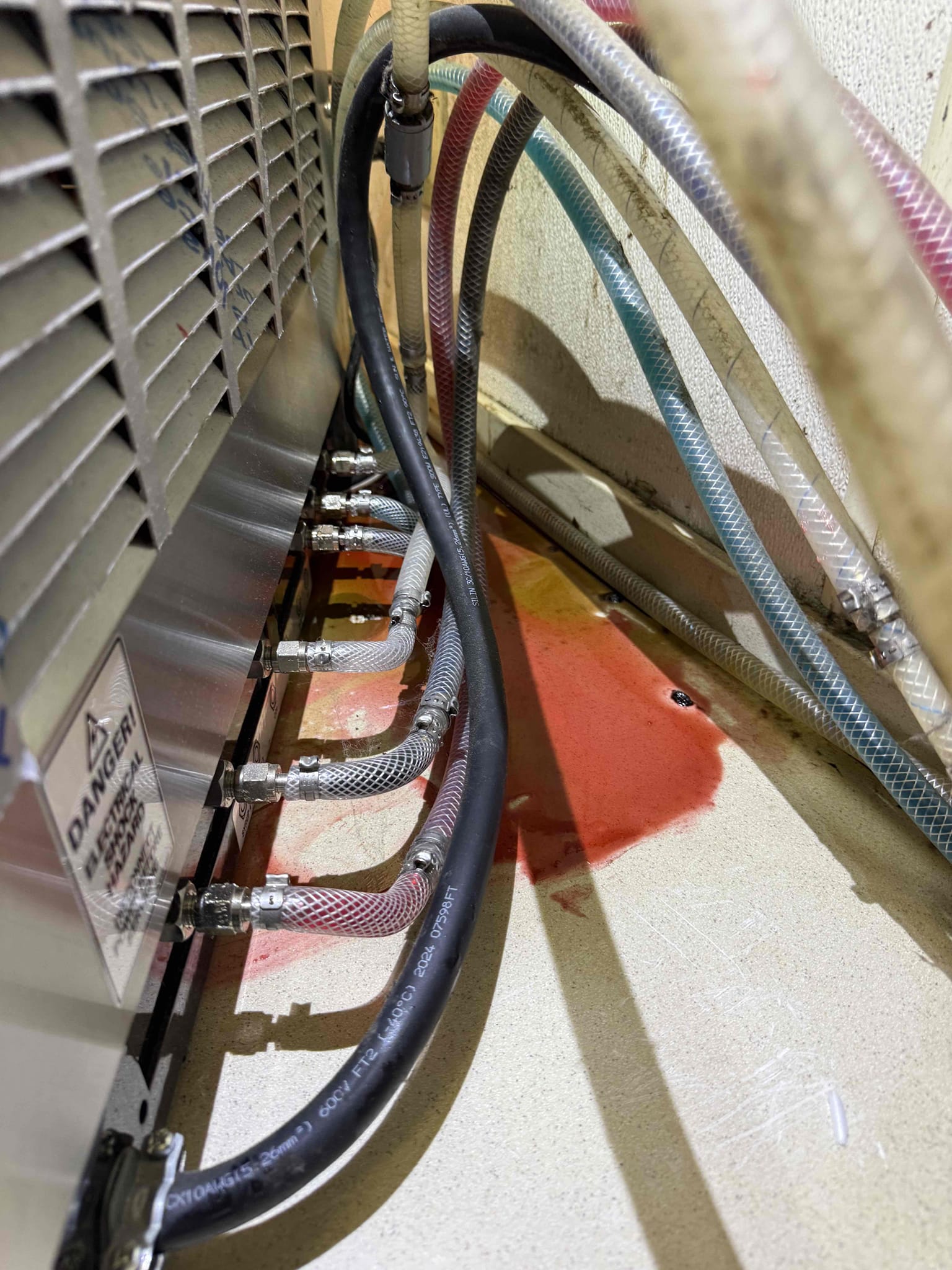 Upon inspection, I identified loose syrup lines at the back of the unit, causing a leak. I meticulously resealed the affected lines, ensuring a secure and tight connection. The system was tested post-repair, confirming that the leak had ceased. The unit is now functioning properly, with no signs of leakage.