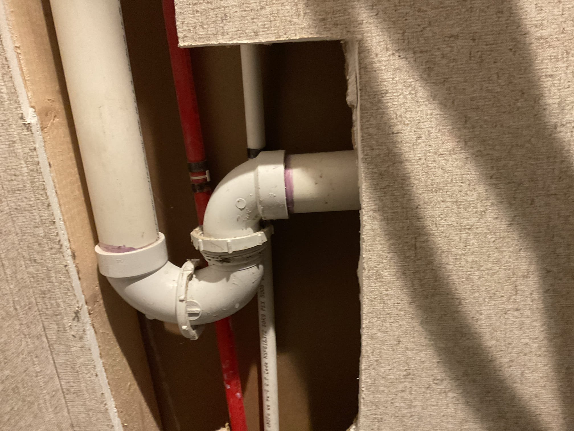 Our team successfully completed the plumbing work by carefully cutting a designated section of the wall to access the existing drain pipe. We meticulously plumbed the new drain according to all relevant codes and standards, ensuring compliance and efficiency. Additionally, we connected all associated plumbing components, guaranteeing a seamless integration with the existing system. Our work was precise and professional, focusing solely on the plumbing aspects. It is important to note that while we handled the plumbing, the responsibility for any drywall repair is not included in our scope of work.