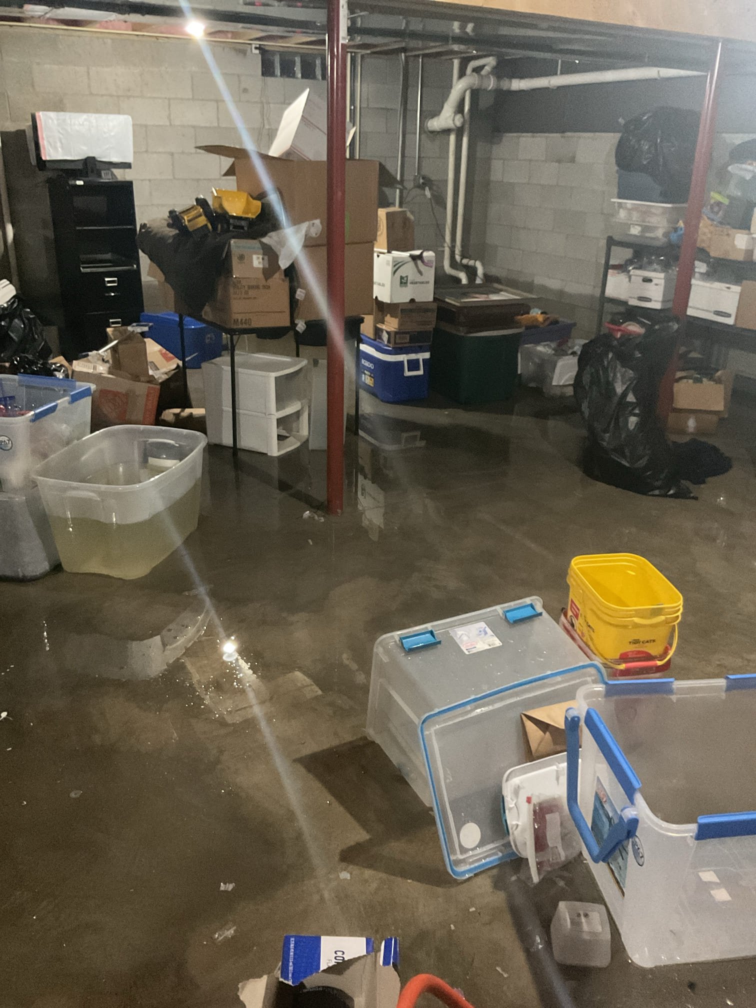 Upon arrival, I found the basement water level at an inch, though it had previously reached knee height. I thoroughly inspected the plumbing system, which was accessible due to the open ceiling and basement size. No leaks or drips were observed in the drainage system when the house was fully operational. Both water heaters appeared functional, though they had absorbed some water. The sump pump, three years old, was initially off, but it activated immediately upon turning the breaker back on, effectively managing the water. The grinder pump also operated intermittently. Based on these observations, the flood was likely due to a tripped sump pump and grinder pump, possibly caused by a storm-induced power flicker. The client plans to have HVAC inspected for proper functioning.